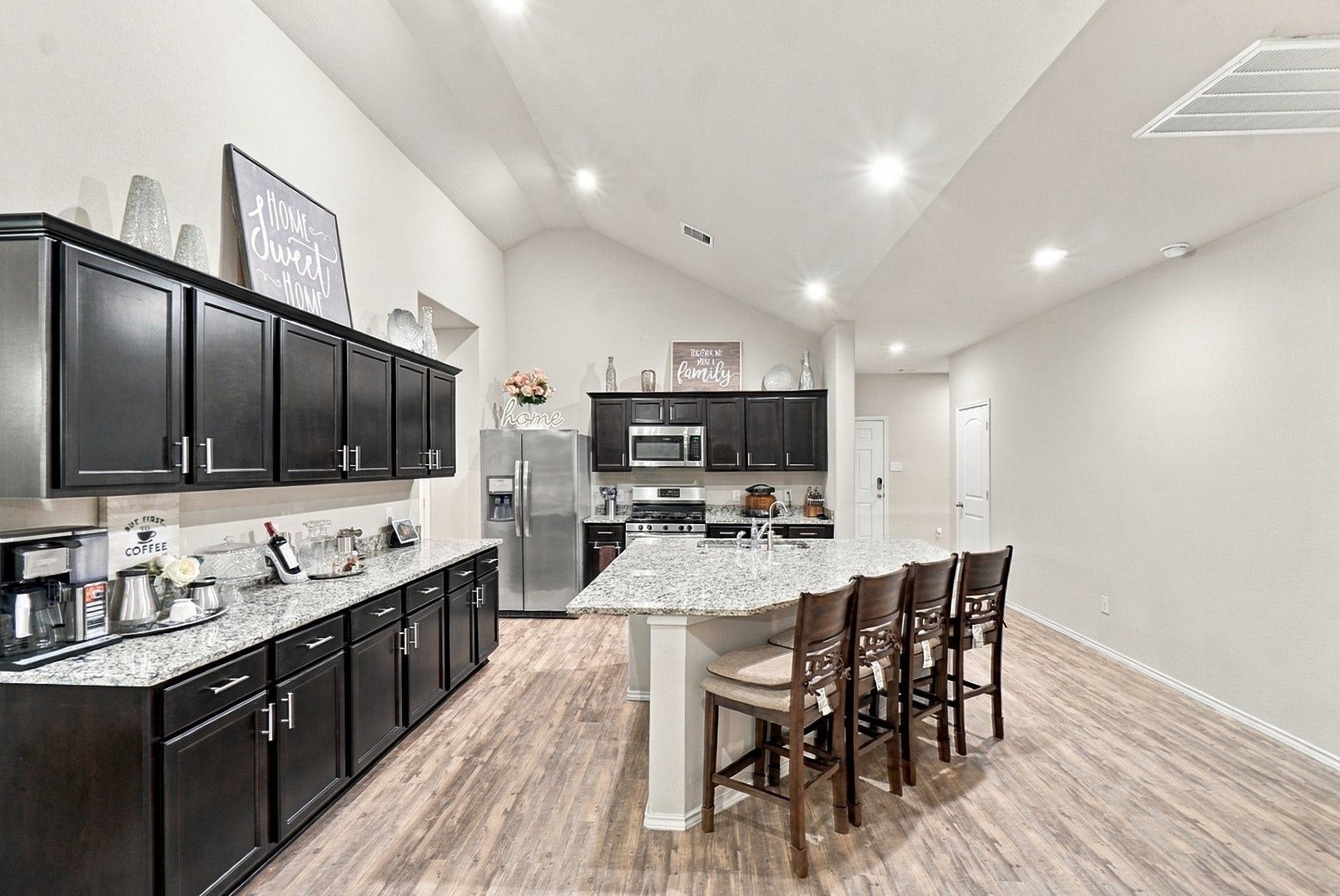 18042 Atwood Mill Drive, New Caney, TX 77357 Designed for gathering! The expansive kitchen island provides generous prep space and seating for four.