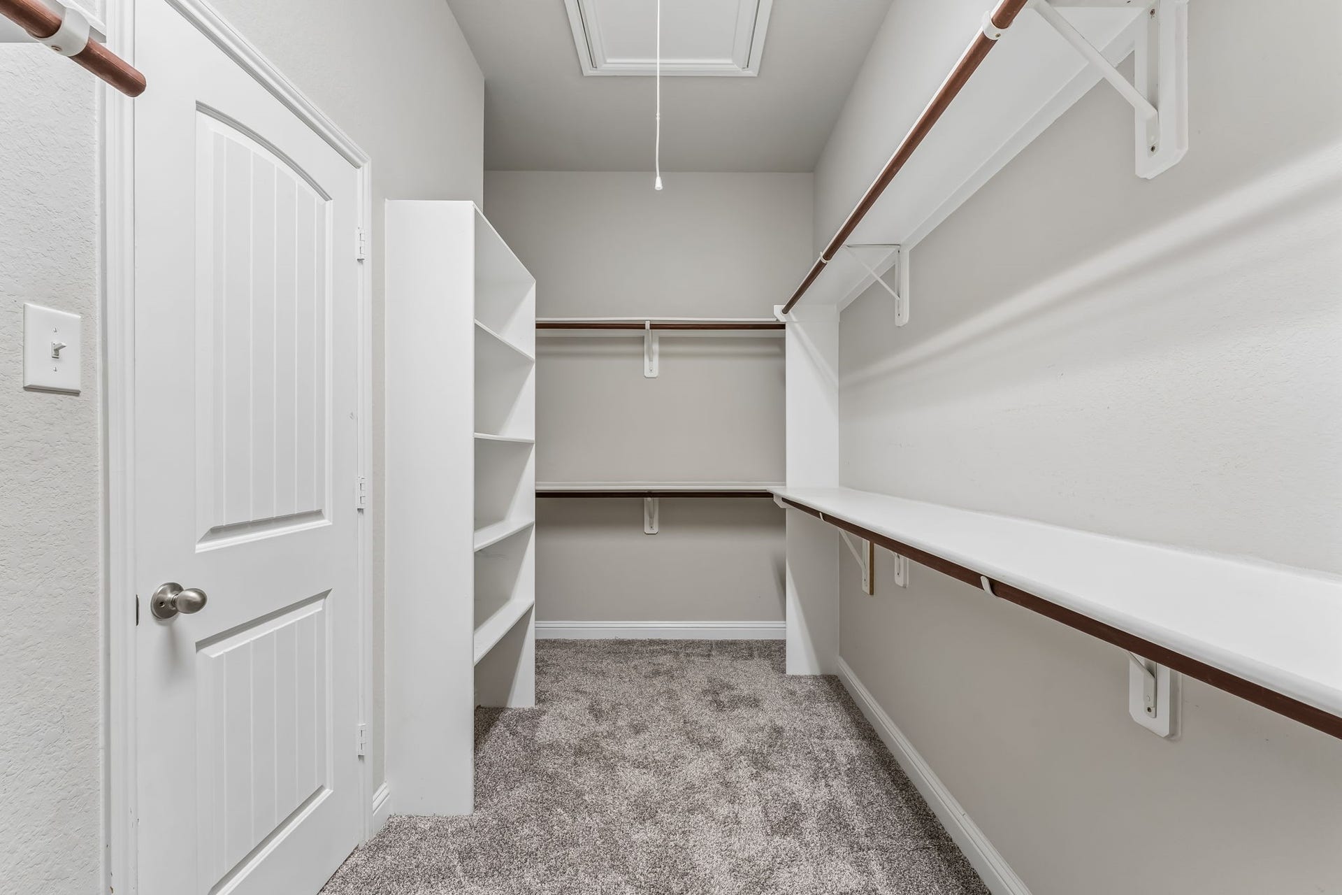 5107 Baroness Lane, Katy, TX 77493 Spacious walk-in closet with ample shelving and hanging space, perfect for organized storage.