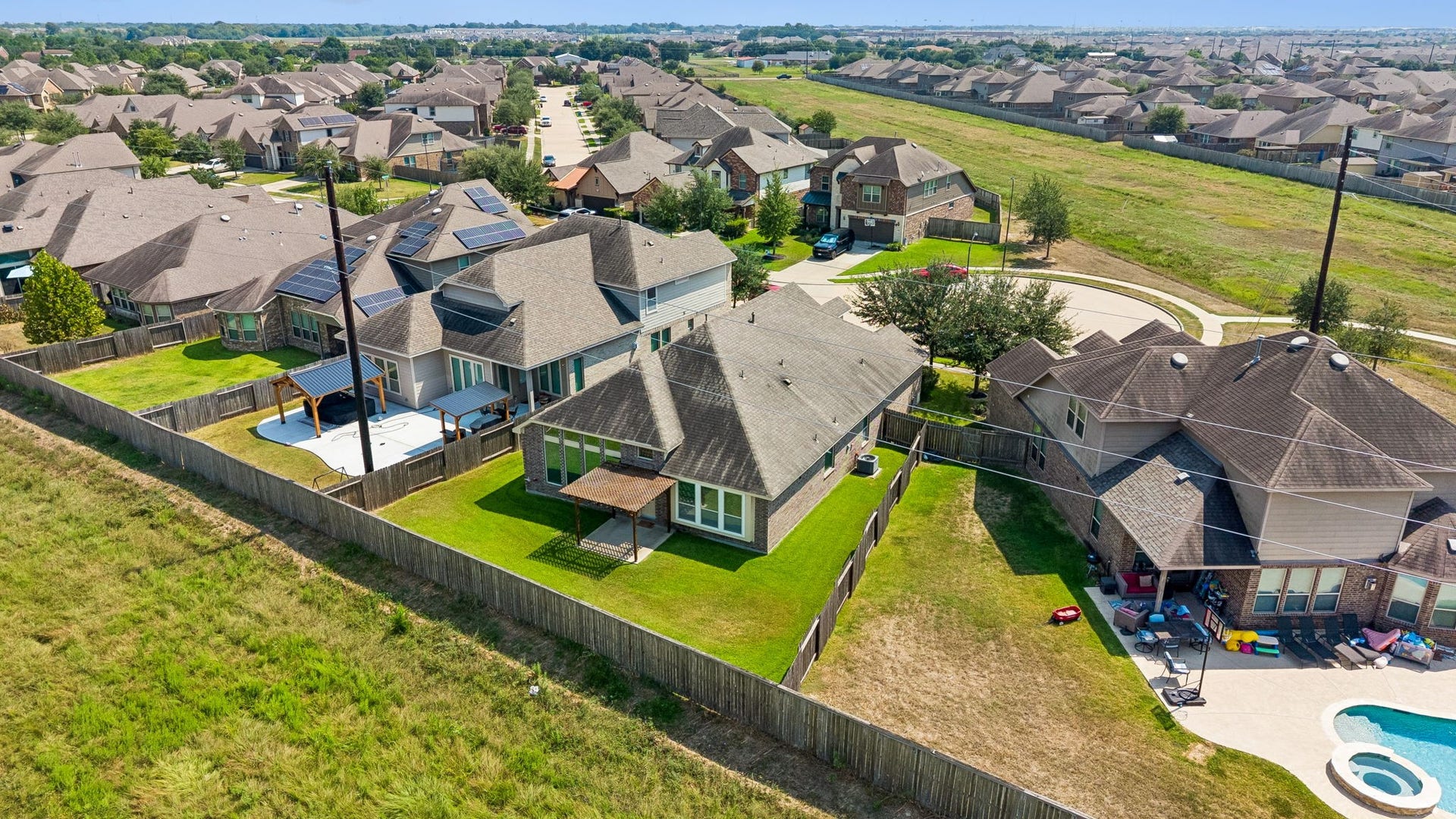 5107 Baroness Lane, Katy, TX 77493 Aerial view of a charming cul-de-sac neighborhood featuring spacious backyards, against a lush greenbelt for added privacy of no back neighbors on a private street.