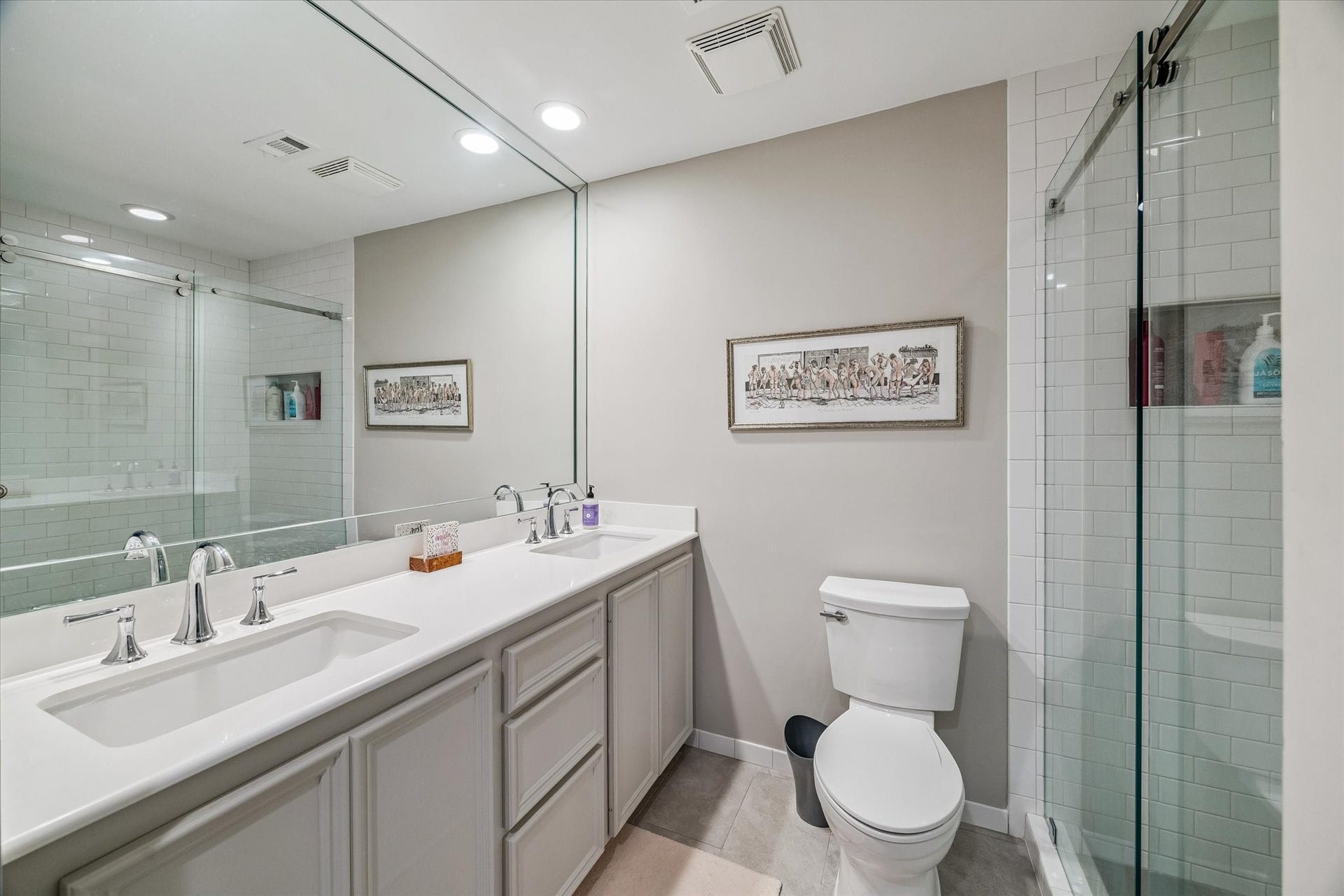 5904 Valley Forge Drive, #157, Houston, TX 77057 Spacious Primary Bath boasts dual undermounted sinks, marble counters and full length framed mirror, large frameless glass shower with timeless subway tile, worlds of built-in storage, large walk-in closet and more! Ahhh!
