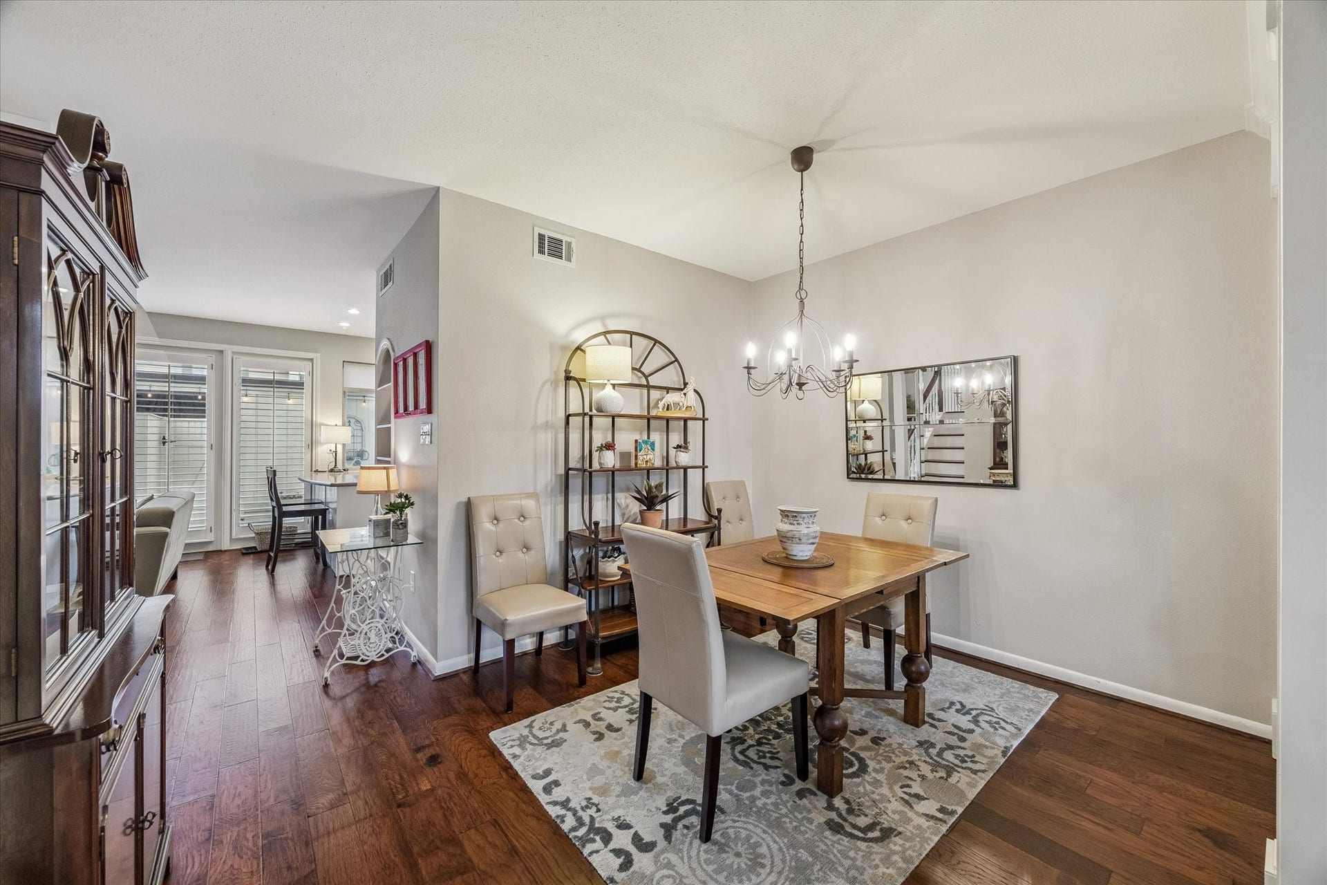 5904 Valley Forge Drive, #157, Houston, TX 77057 Your new formal Dining Room boasts an open space created by the expanded arched way, thus allowing for any size dining arrangements - large or small! Beaming beautiful wood floors, crisp floor and shoe molding, designer pewter 6 candle chandelier, high ceilings and be sure you check out the wonderful Bar area - ideal for entertaining!