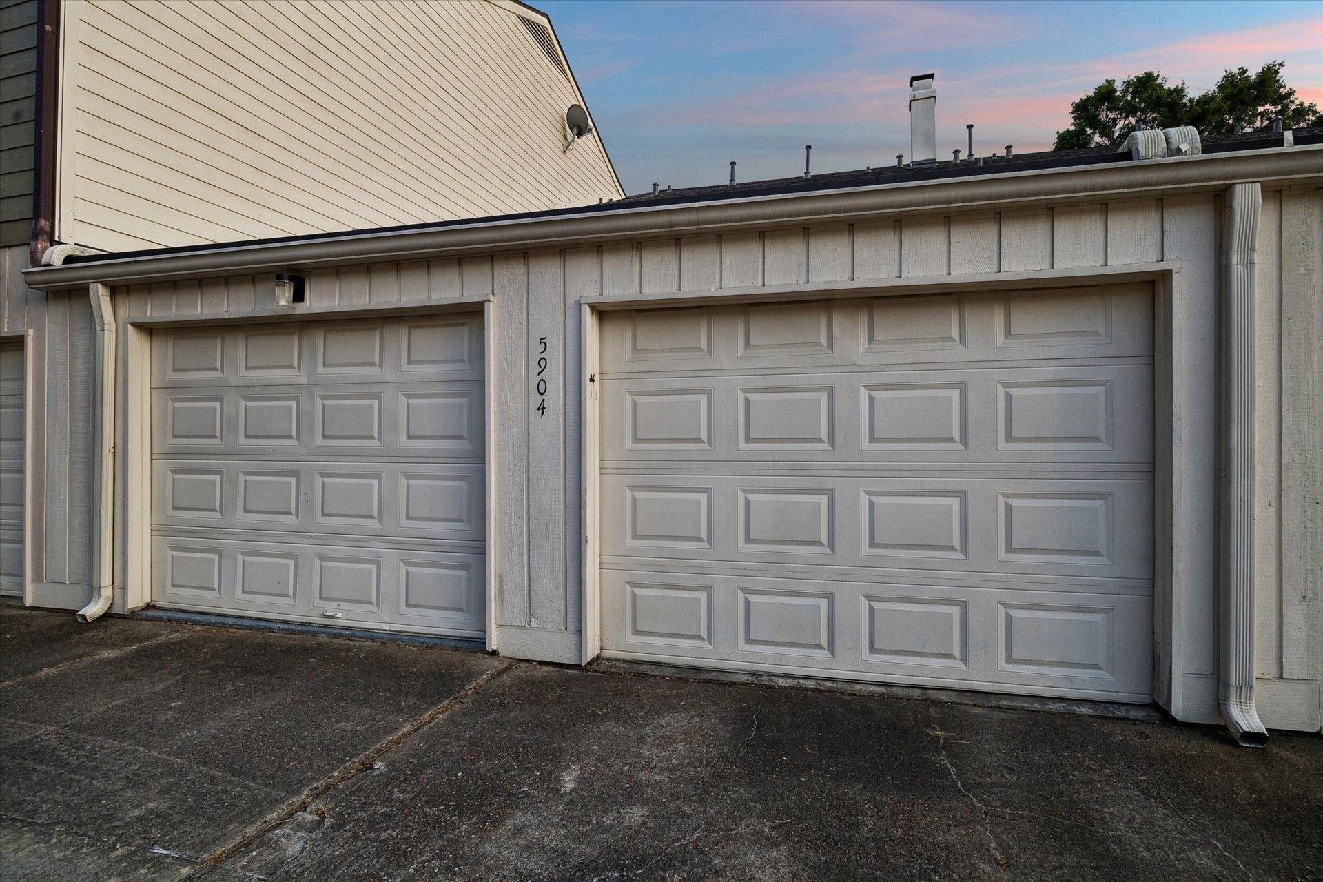 5904 Valley Forge Drive, #157, Houston, TX 77057 HOW GREAT IS THIS?! Seller remodeled the original carport to create 2 separate garages with their own automatic overhead doors and remotes! NOTE the massive back driveway promotes easy car/truck maneuverability and is only accessible thru one drive, adding security and eliminating drive thru traffic! WONDERFULLY CONVENIENT!