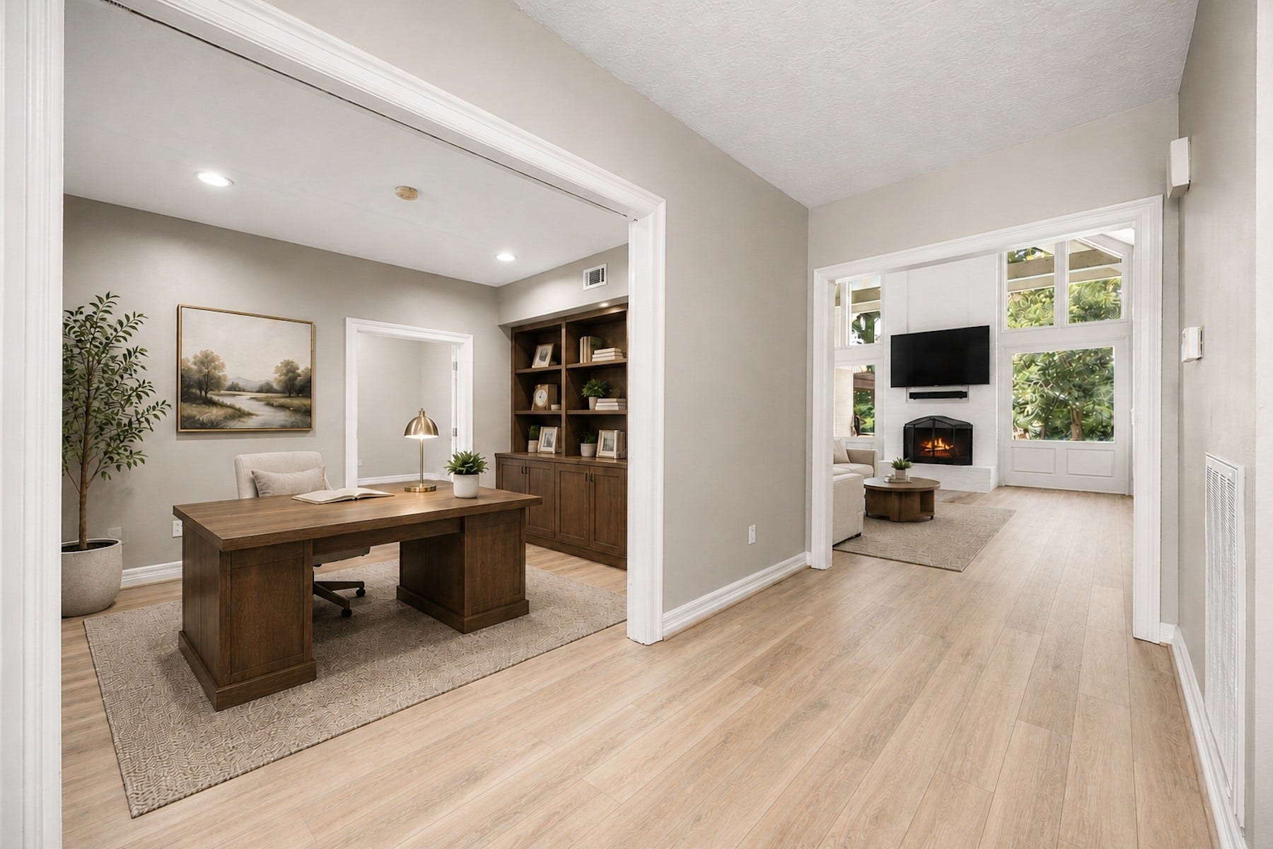 Virtually staged to illustrate the ideal home office, while the open floor plan maintains effortless flow into the main living spaces.