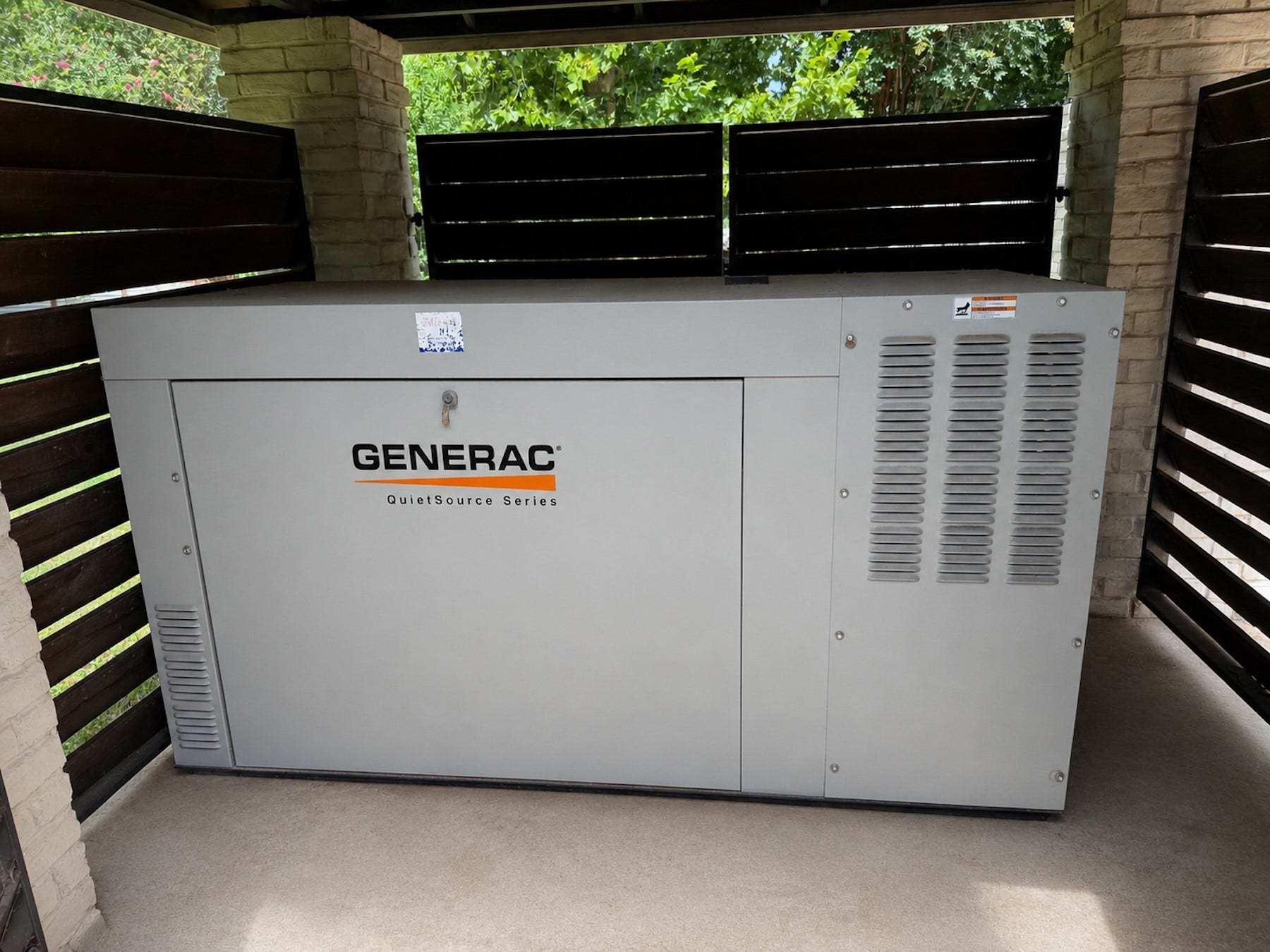 Rare whole-property generator system with a 36 kW generator and buried 1,000-gallon propane tank powers both the main home and guest house.
