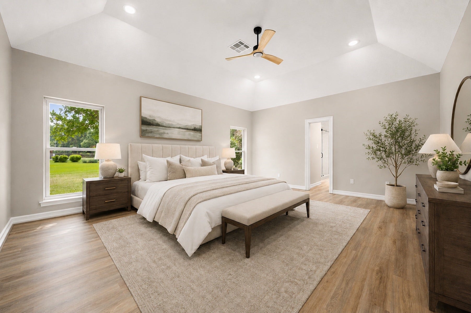 The impressive and spacious first-floor primary retreat is filled with natural light and has been virtually staged.