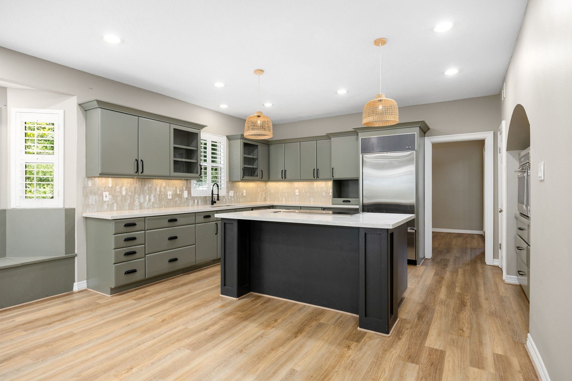 Beautifully updated kitchen with oversized island and premium appliances. This is truly the heart of the home.