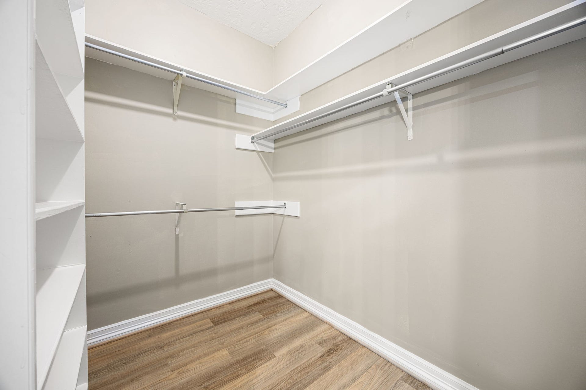 Expansive walk-in closet with built-in organization. One of two in the primary suite.