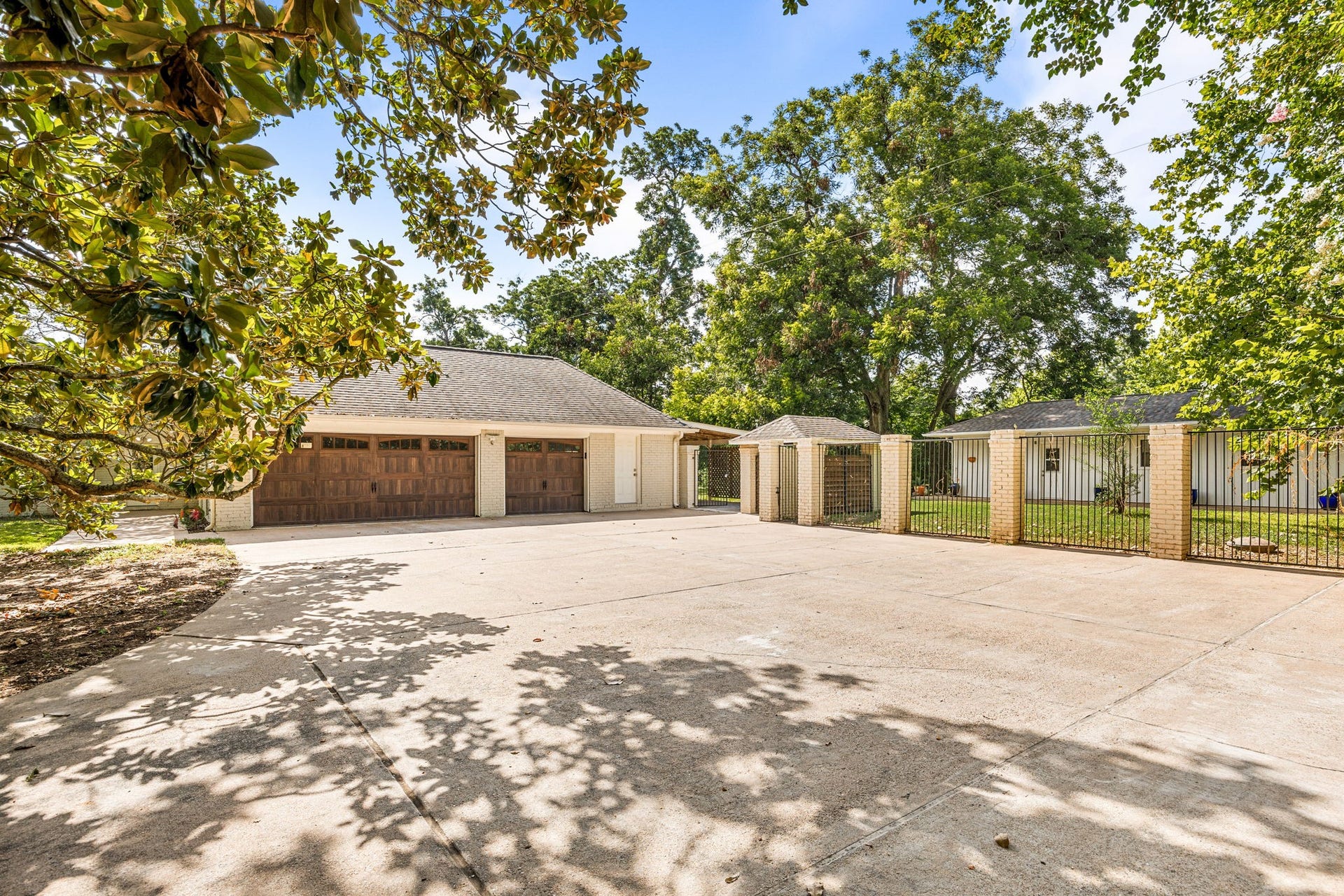 Detached three-car garage with workshop and EV charging station.