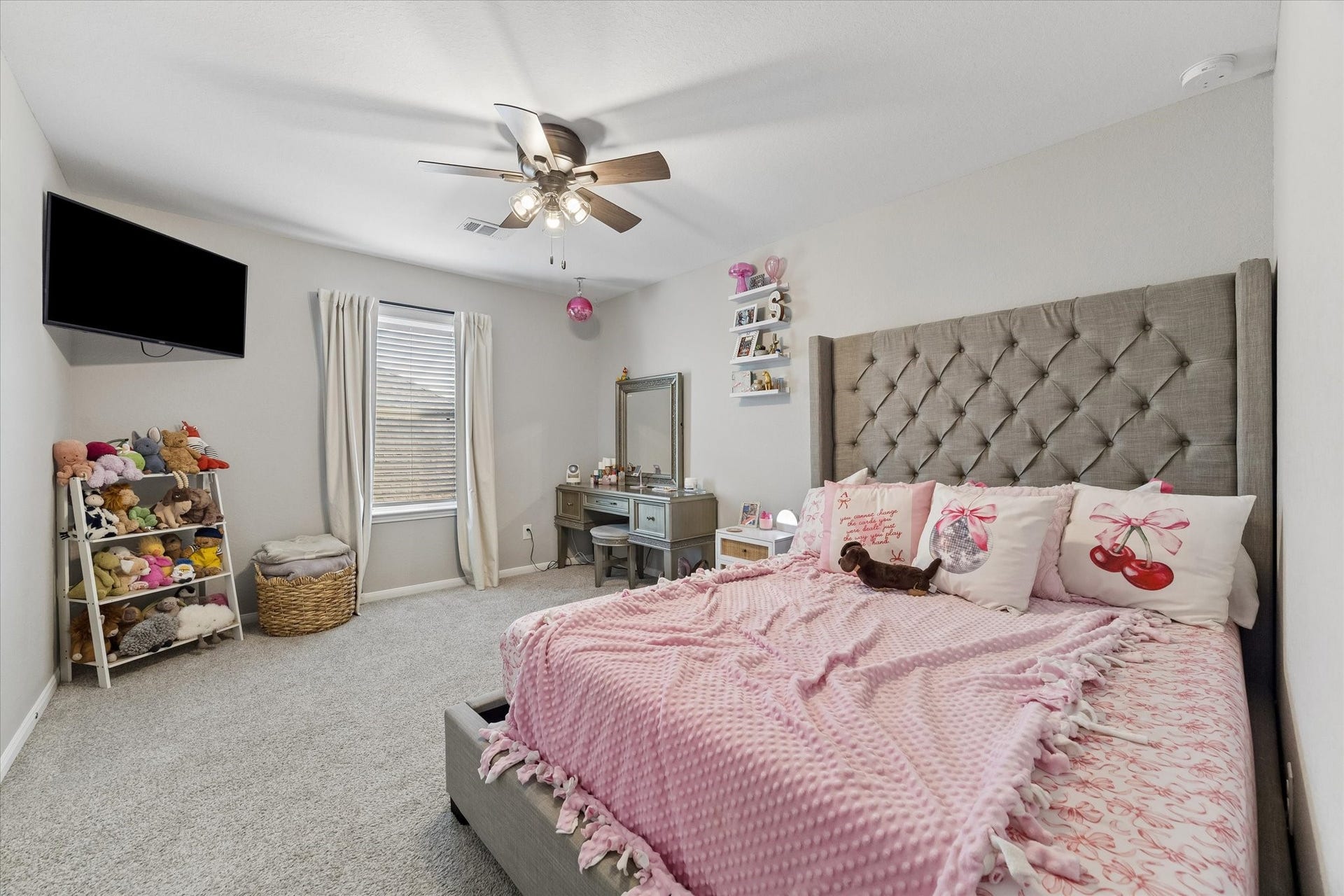 14918 Lake Shore Avenue, Mont Belvieu, TX 77523 A huge walk-in closet adds standout storage to this upstairs secondary bedroom, with ample room for clothing, shoes, and more.
