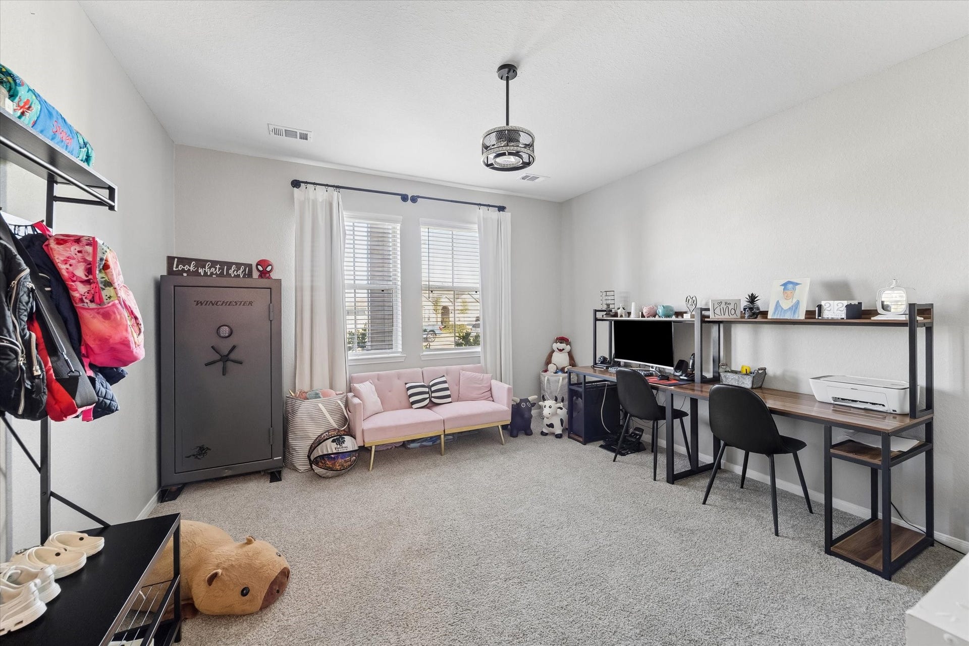 14918 Lake Shore Avenue, Mont Belvieu, TX 77523 An additional downstairs living space offers a comfortable retreat within the private guest wing. Paired with a bedroom and full bathroom, this area provides flexibility for extended stays or a potential mother-in-law suite.