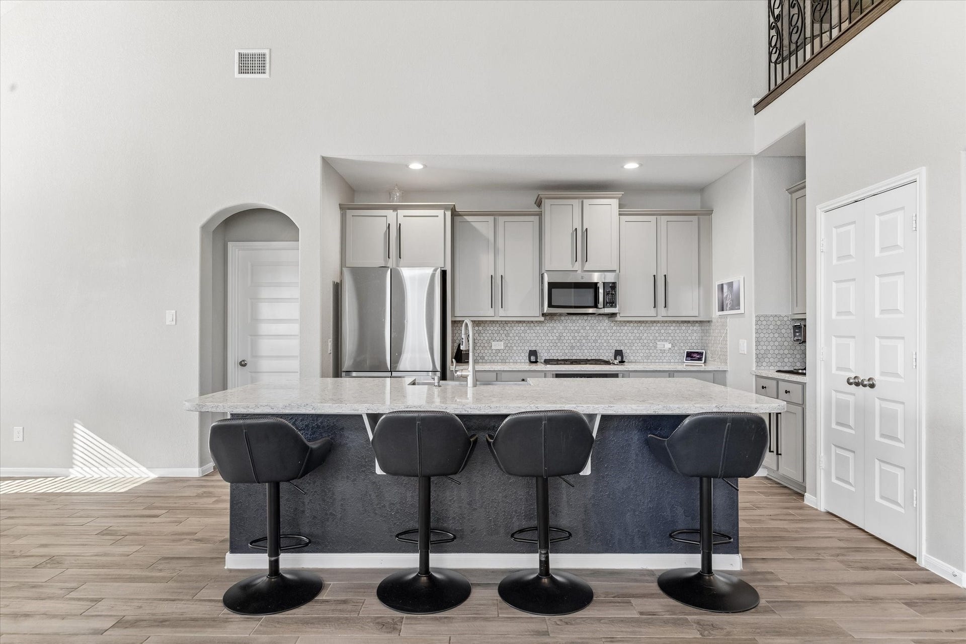 14918 Lake Shore Avenue, Mont Belvieu, TX 77523 An expansive island provides room for meal preparation and casual seating, with open sightlines that keep everyone part of the conversation.