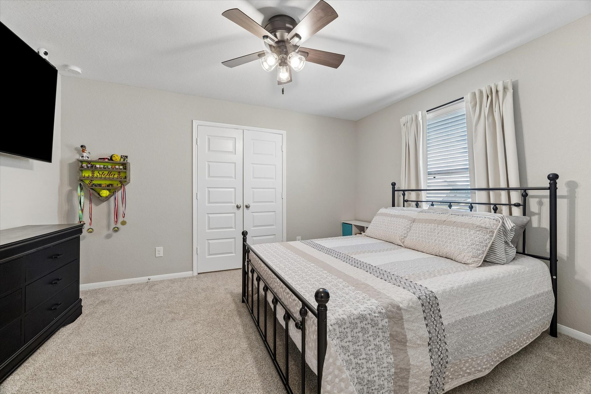 14918 Lake Shore Avenue, Mont Belvieu, TX 77523 This spacious upstairs secondary bedroom offers plenty of room to make it your own, complete with a huge walk-in closet for generous storage.