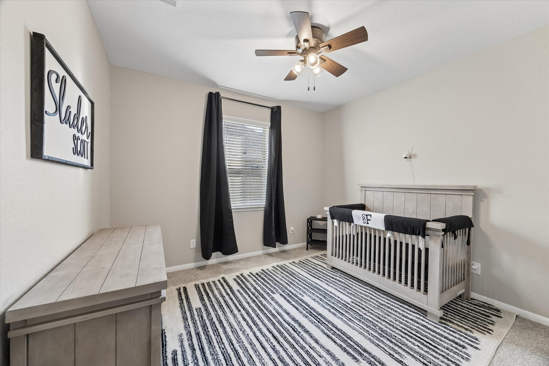 14918 Lake Shore Avenue, Mont Belvieu, TX 77523 Located in the private downstairs guest wing, this bedroom connects with an additional living space and full bathroom, offering a flexible layout for guests or extended stays.