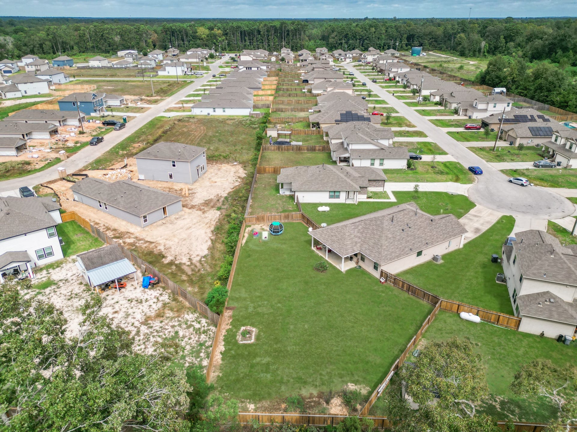 11064 Patriot Court, Cleveland, TX 77328 Nestled in a charming suburban neighborhood, this spacious property features a large backyard perfect for outdoor activities, surrounded by well-maintained homes and lush greenery.