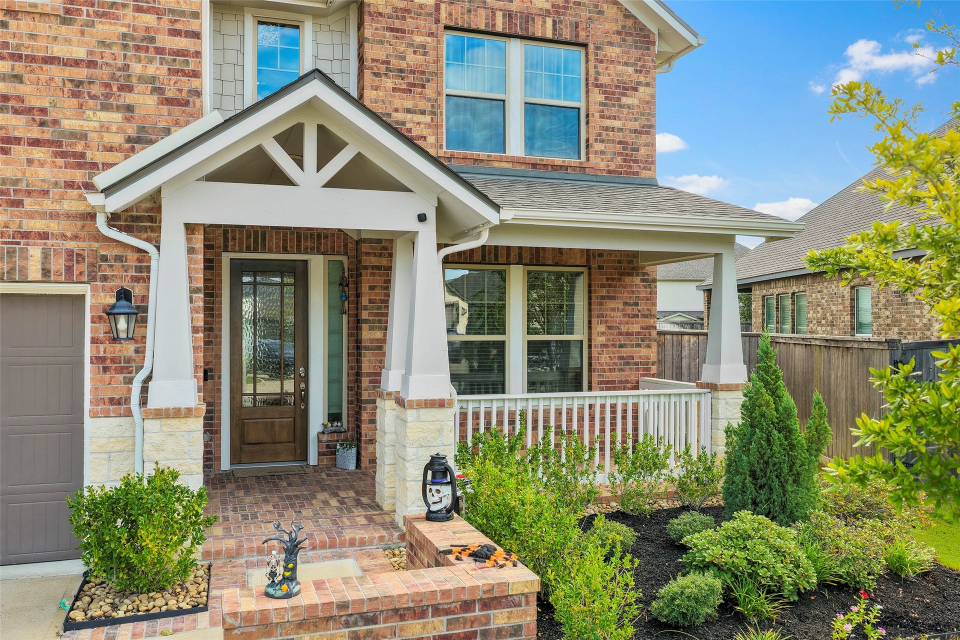 10810 Carolina Willow Court, Cypress, TX 77433 Welcoming front entry framed by attractive landscaping and a covered porch.