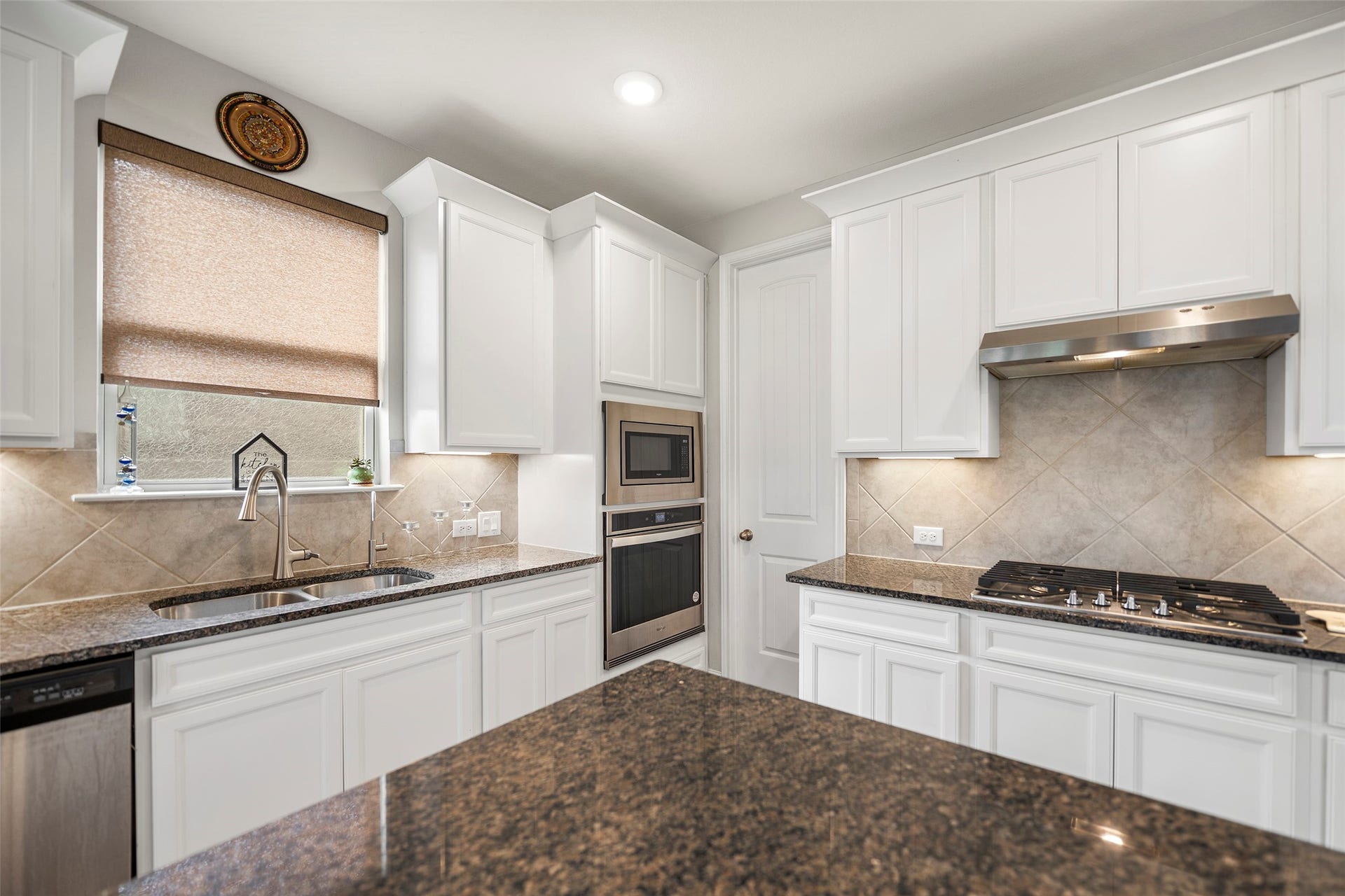10810 Carolina Willow Court, Cypress, TX 77433 Another kitchen view highlighting the ample cabinetry and counter space.