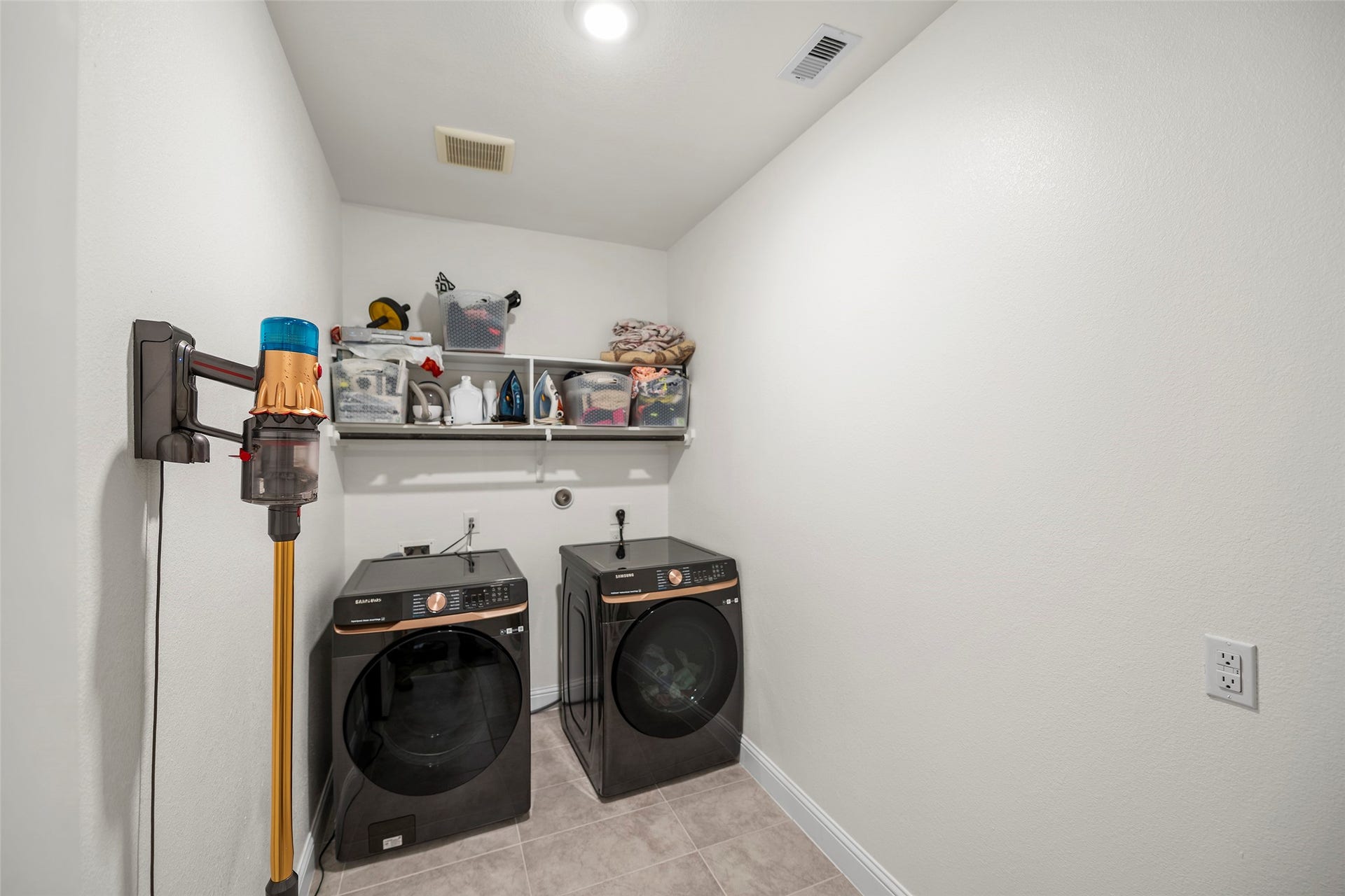 10810 Carolina Willow Court, Cypress, TX 77433 Convenient laundry room with space for everyday household needs.