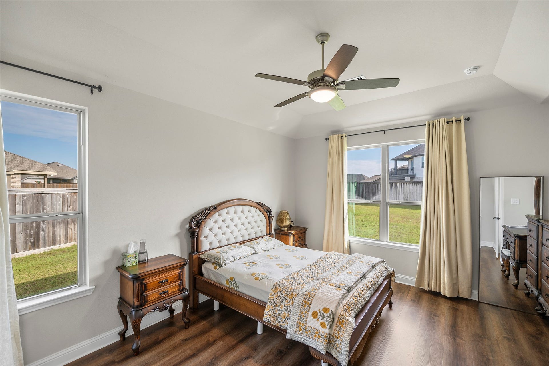 10810 Carolina Willow Court, Cypress, TX 77433 Spacious primary bedroom with large windows and plenty of natural light.