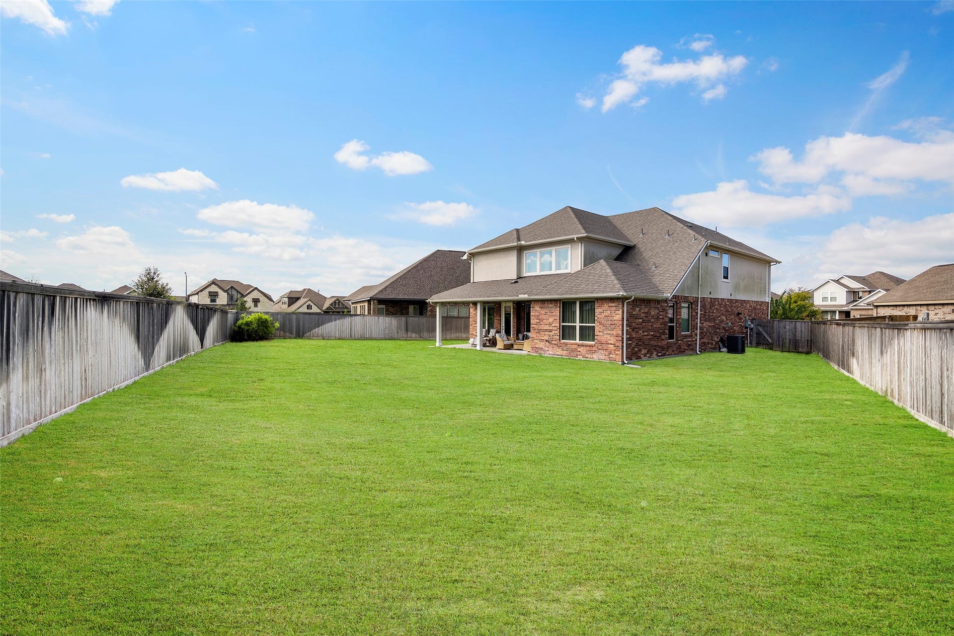 10810 Carolina Willow Court, Cypress, TX 77433 Expansive fenced backyard with plenty of open green space.