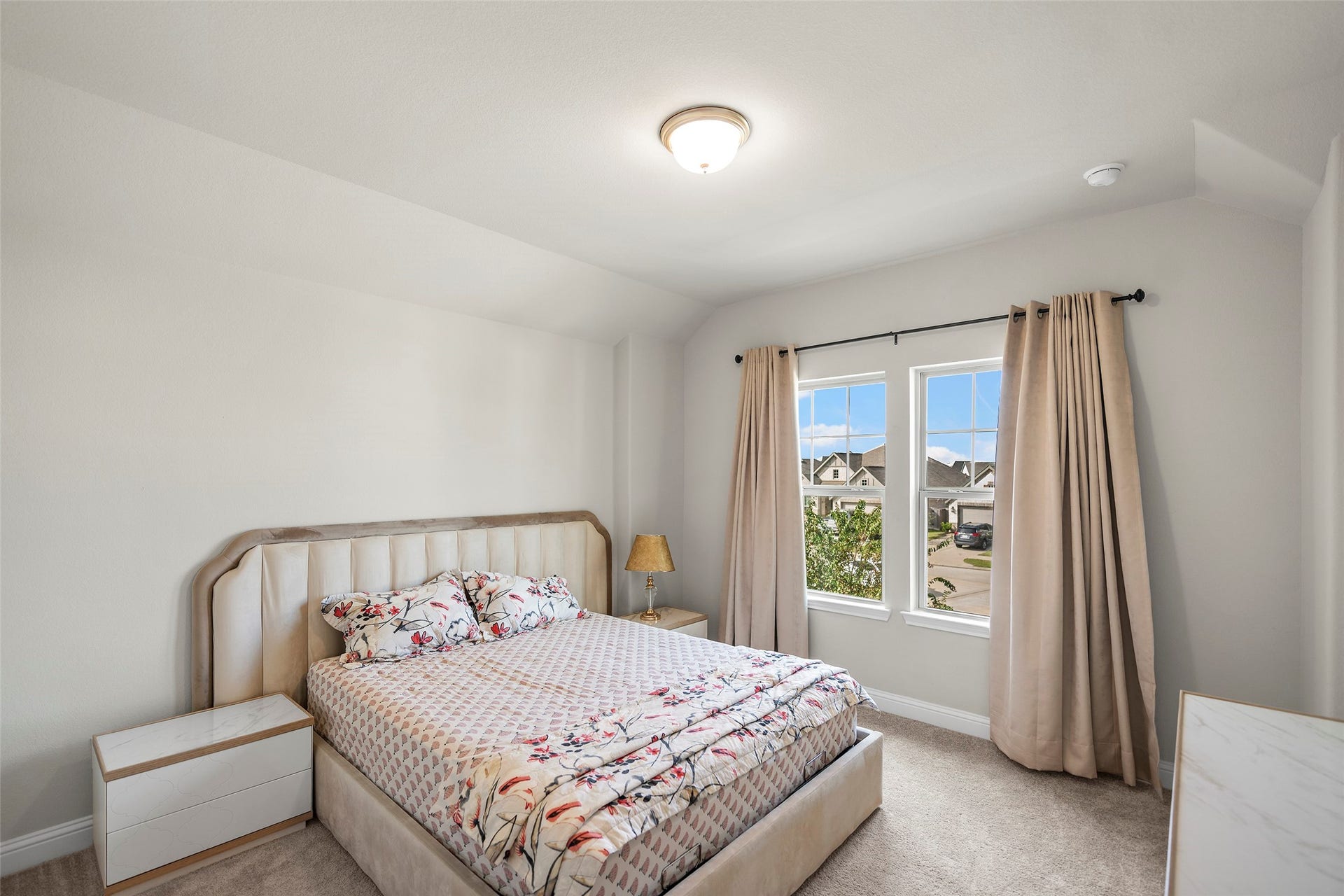 10810 Carolina Willow Court, Cypress, TX 77433 Bright bedroom with a large window bringing in natural light.