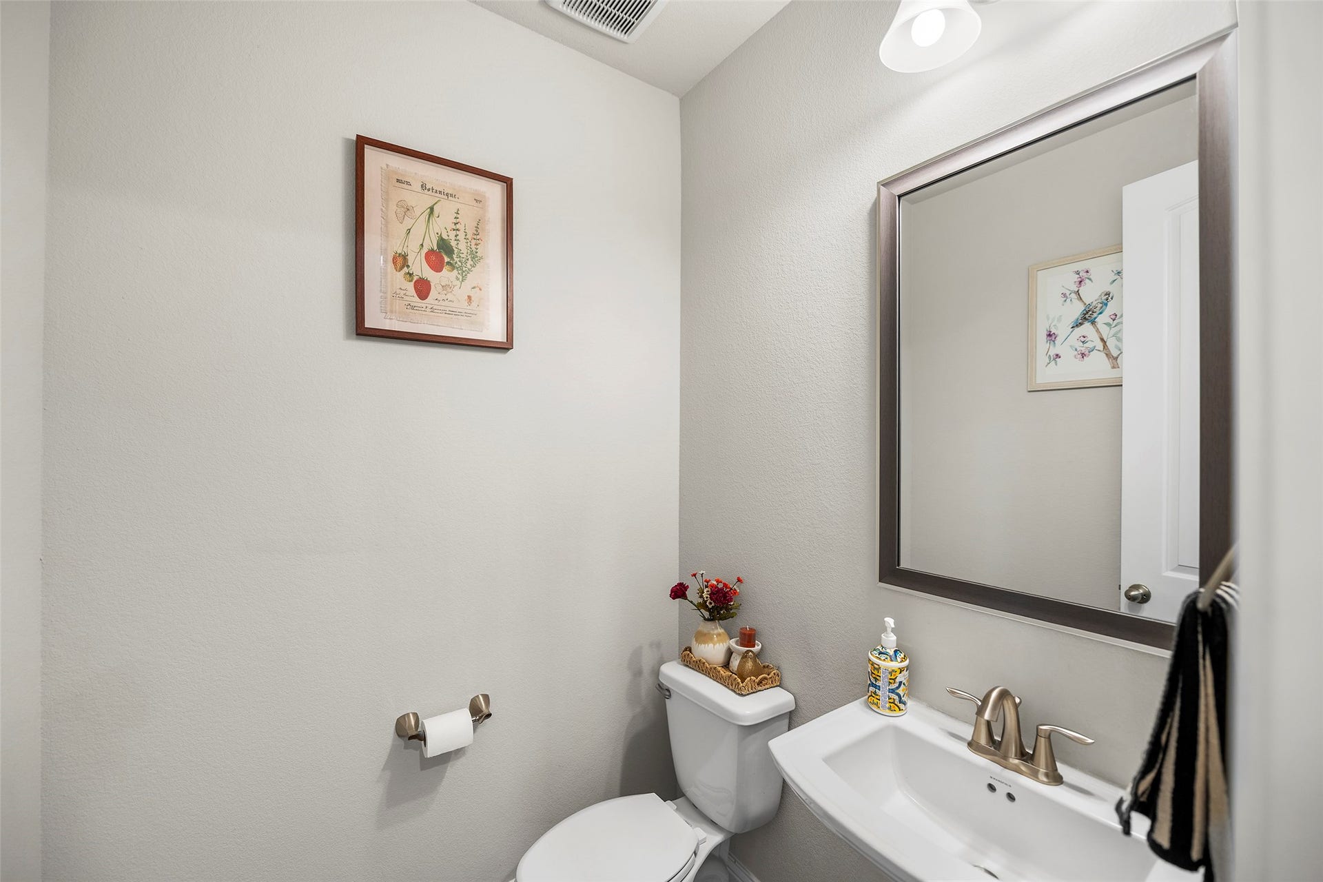 10810 Carolina Willow Court, Cypress, TX 77433 Half bathroom conveniently located on the main level.