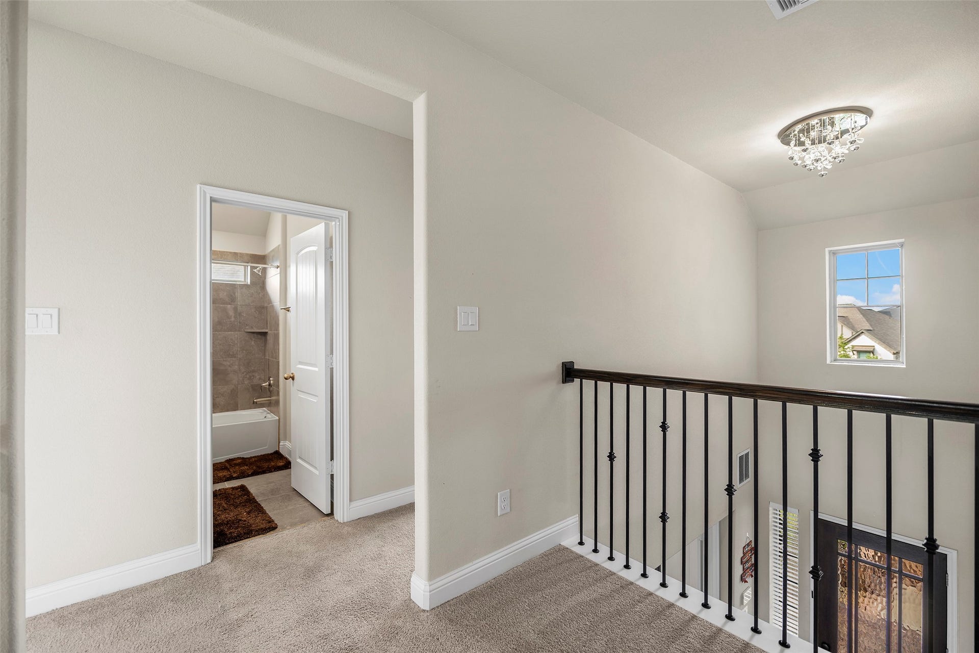 10810 Carolina Willow Court, Cypress, TX 77433 Upstairs landing overlooking the main living area below.