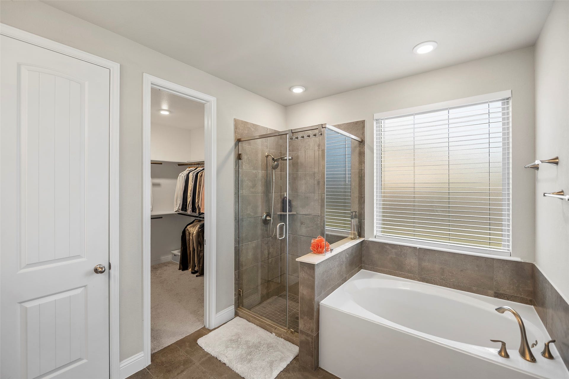 10810 Carolina Willow Court, Cypress, TX 77433 Primary bathroom with a soaking tub, separate shower, and spacious layout.