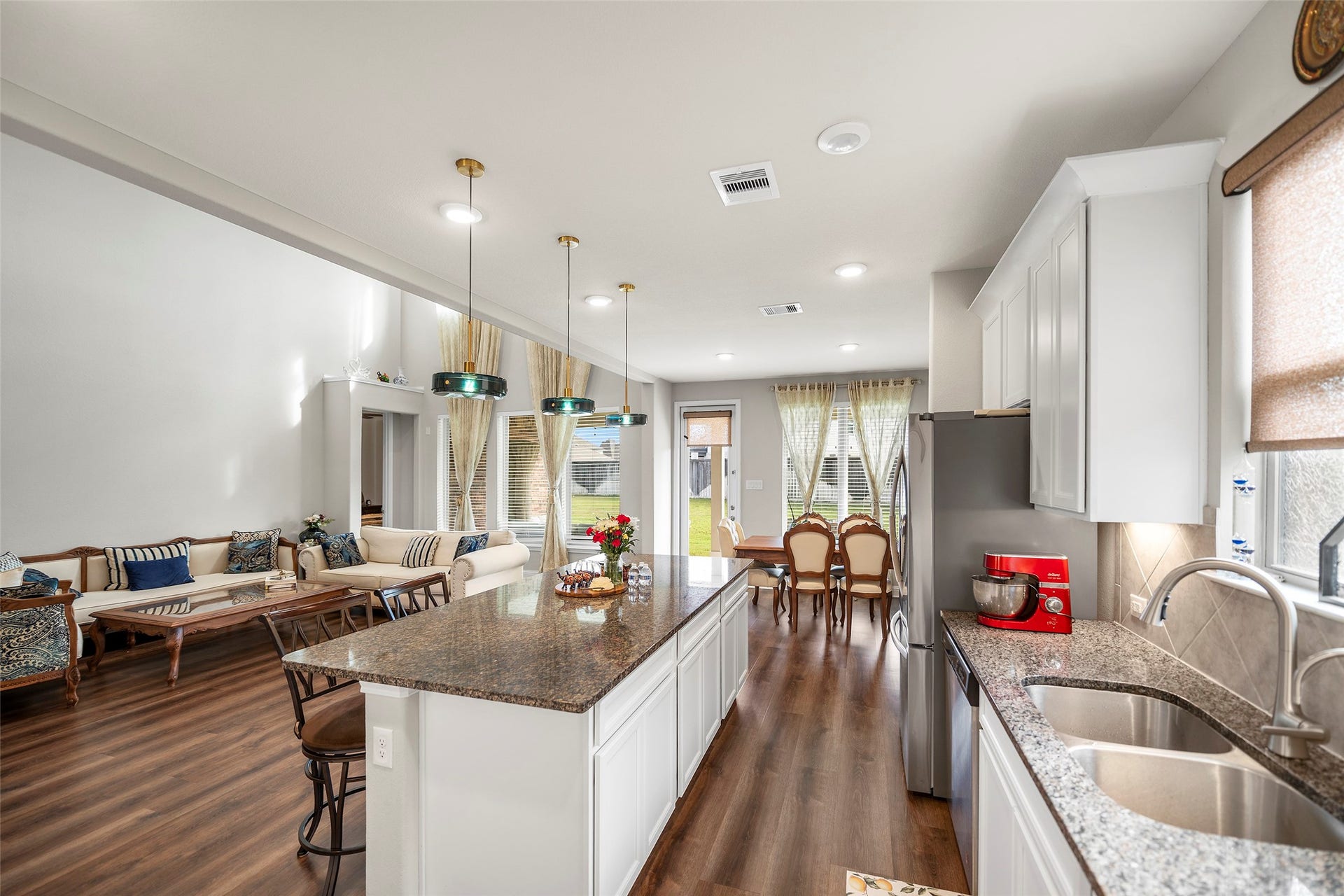 10810 Carolina Willow Court, Cypress, TX 77433 Open-concept layout offering an easy flow between the kitchen, dining, and living areas.