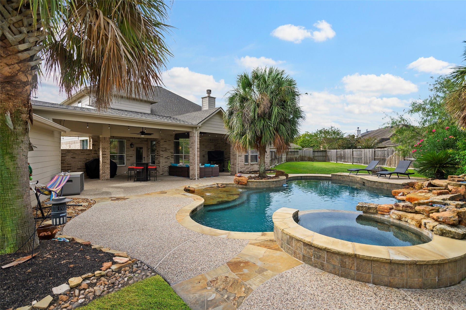 17415 Old Court Drive, Tomball, TX 77377 Another view of the pool, covered patio and yard.