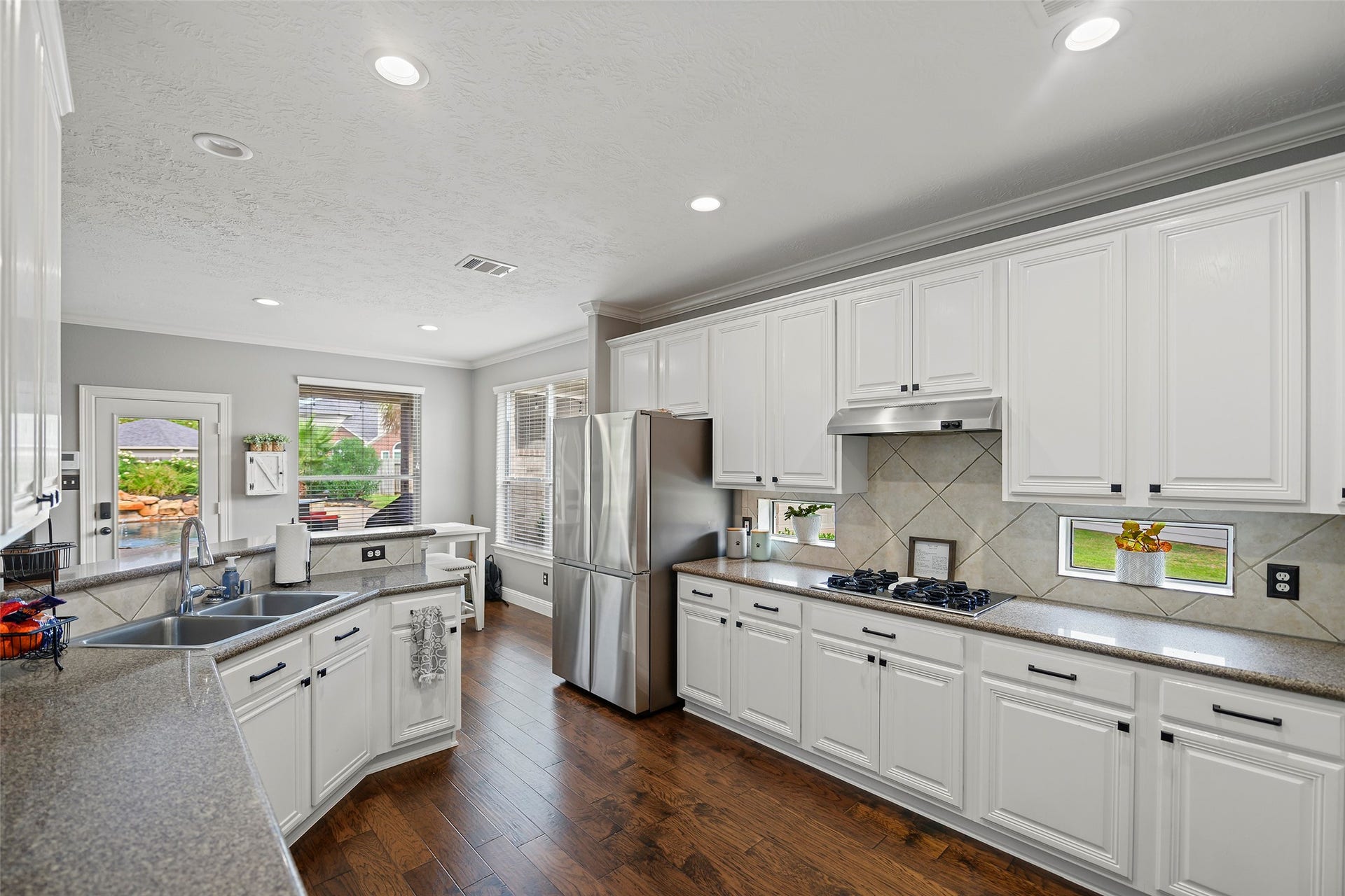 17415 Old Court Drive, Tomball, TX 77377 Kitchen looking at Breakfast Room and Pool in Backyard