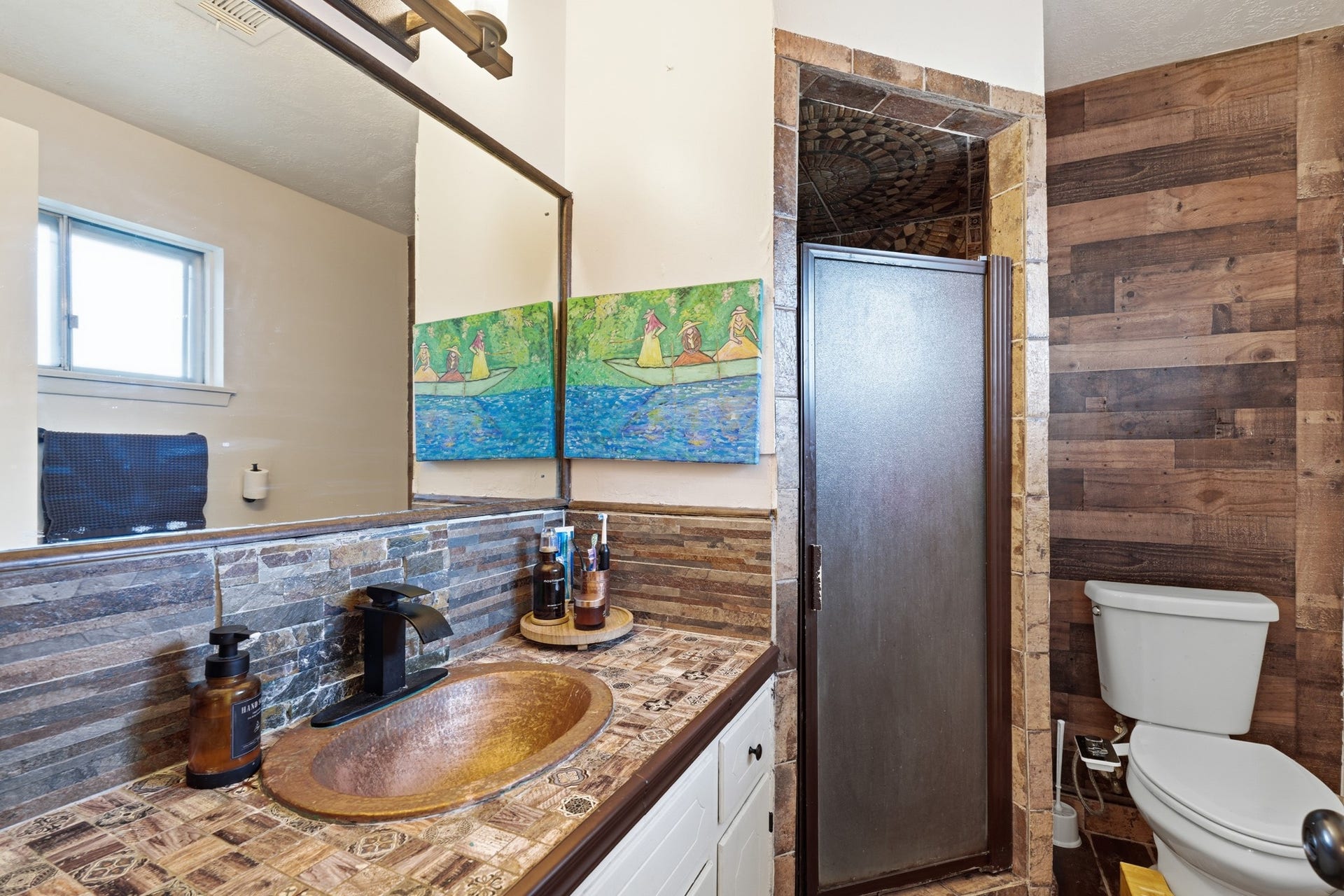 2216 Peach Lane, Pasadena, TX 77502 Discover the charm of this stylish full bath located conveniently downstairs near the master suite, featuring rustic wood accents and modern amenities for a perfect blend of comfort and elegance.
