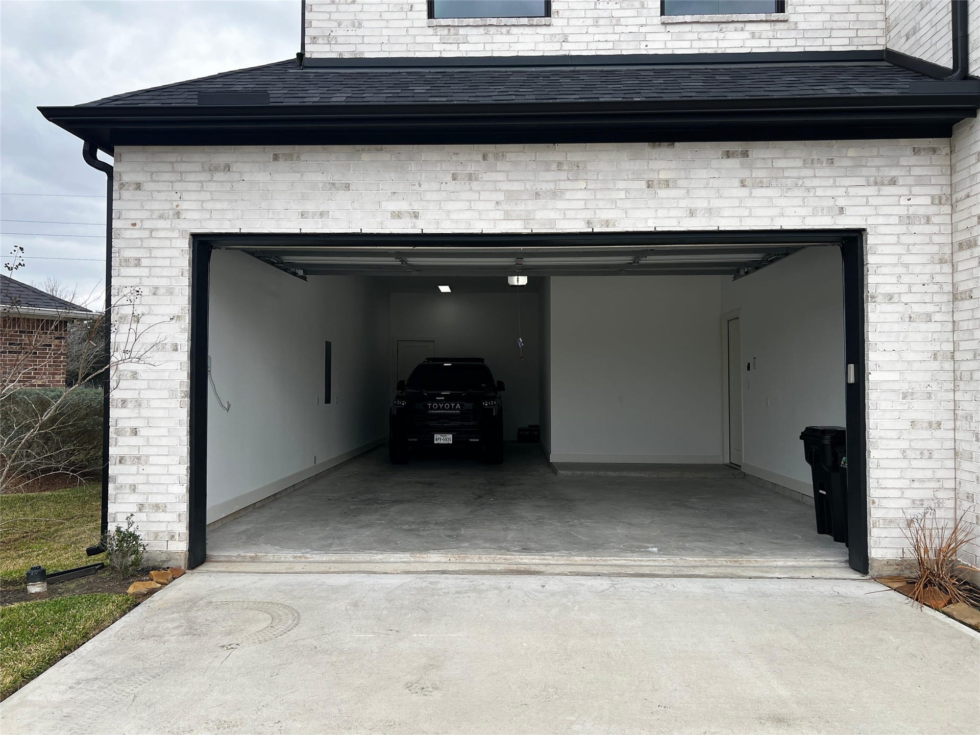 True 3-car oversized tandem garage! The vehicle in the photo is a lifted Toyota Sequoia!!
