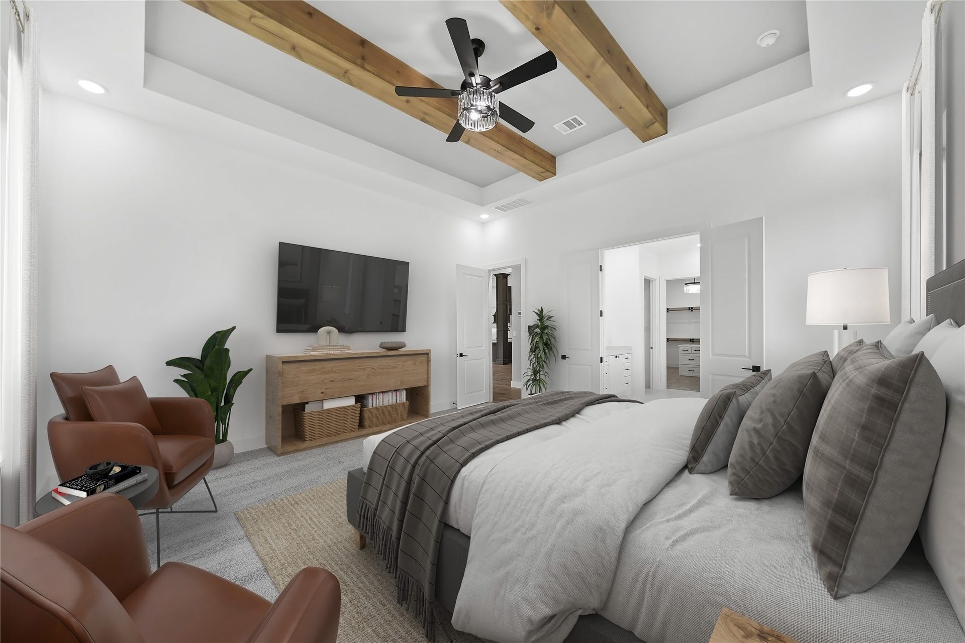 Indulge in the allure of the magnificent primary bedroom, a sanctuary of luxury featuring high ceilings and exposed wood beams that evoke an air of grandeur. Large windows welcome natural light, casting a warm glow across the space. Double doors beckon towards the beautiful ensuite, creating a seamless transition to your private oasis. Discover the convenience of wall TV connections, allowing for personalized entertainment in this exquisitely designed retreat. Virtually staged.