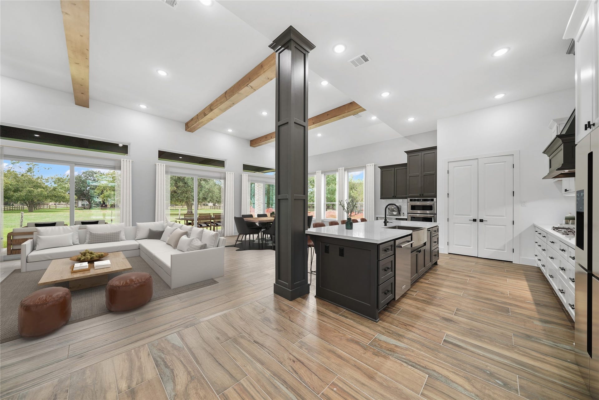 Indulge in the epitome of culinary elegance within this kitchen sanctuary. Oversize quartz island commands attention, complemented by designer accent paint, premium matte black fixtures including a convenient pot filler for added convenience. Custom trash can drawer and full refrigerator cabinet. Upgraded KitchenAid appliances package. Kitchen seamlessly connects to a butler's pantry with a wine cooler and additional drawers, creating a space that marries sophistication with practicality. Virtually staged.