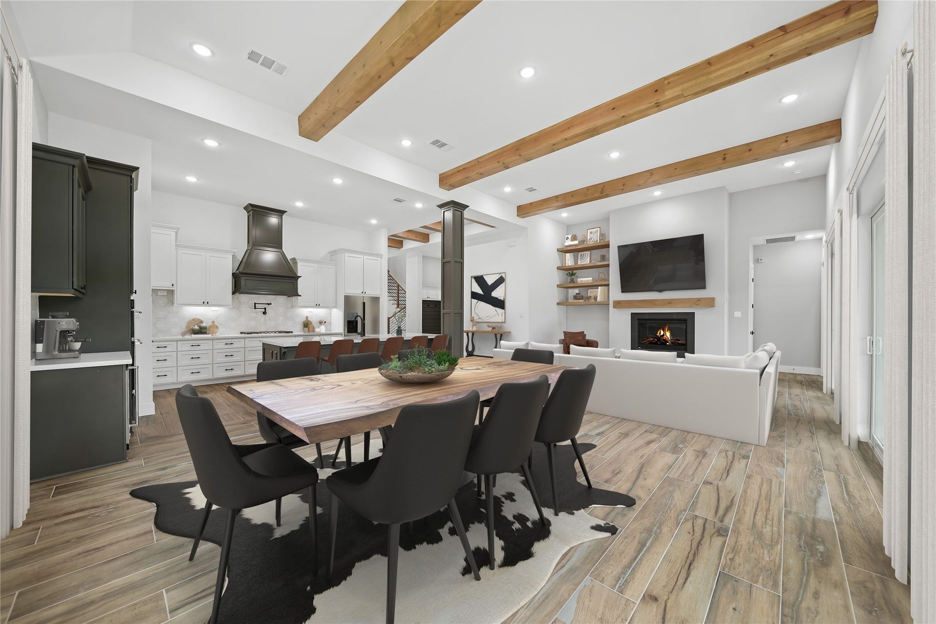 Ceilings just keep getting taller on this home's social areas, where an open floor plan seamlessly merges oversized living and dining spaces. The walls full of oversized sliding doors bathes the room in natural light, creating a bright and inviting atmosphere. Quartz countertops grace the kitchen, and a butler's pantry with a wine cooler and drawer adds a touch of sophistication. Virtually staged.