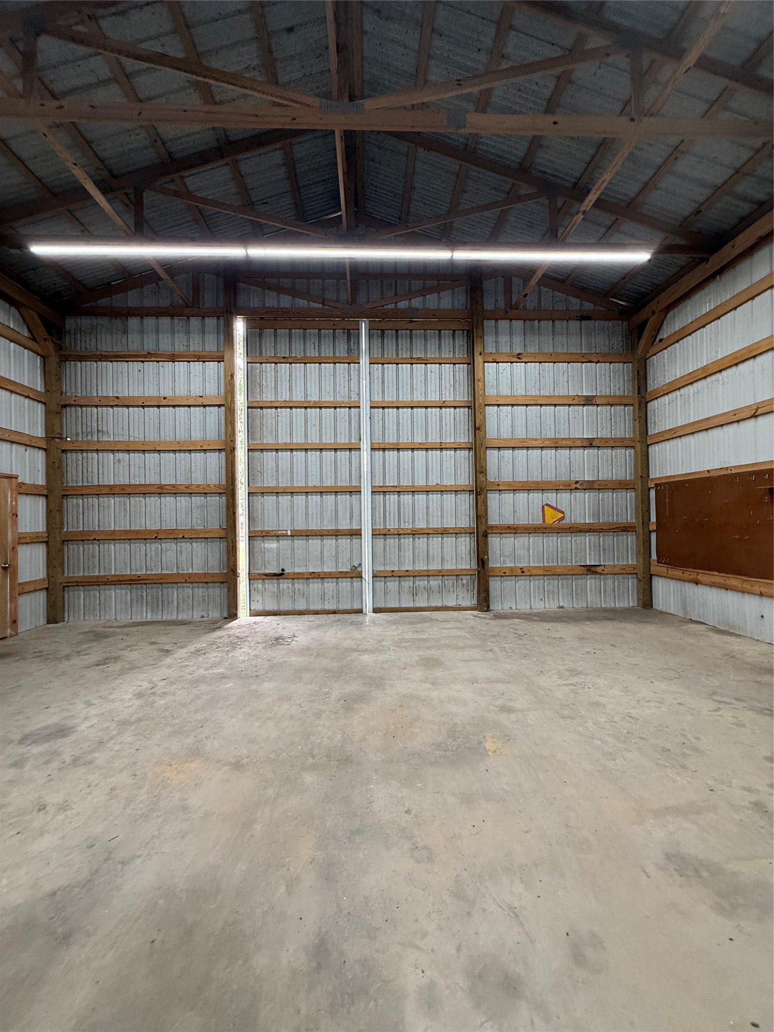LARGE DOORS ON BOTH ENDS OF BUILDING