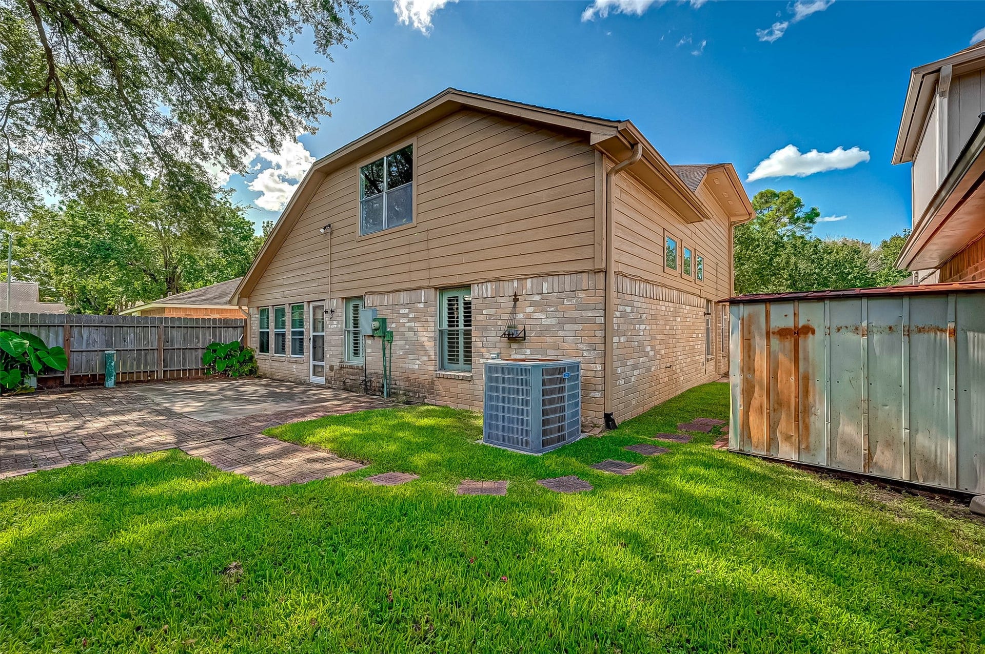 3510 Greenwood Dr Drive, Sugar Land, TX 77478 The backyard features an oversized patio which is great for entertaining!