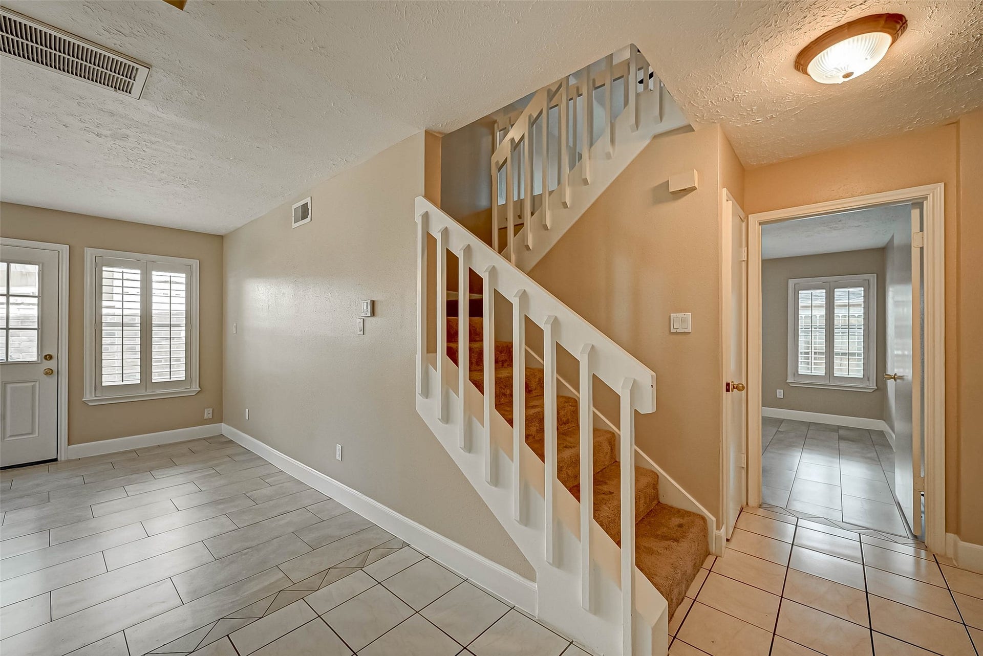3510 Greenwood Dr Drive, Sugar Land, TX 77478 Stairs lead to the upstairs game room, two bedrooms plus a full bath. The open door leads to a fantastic primary suite!