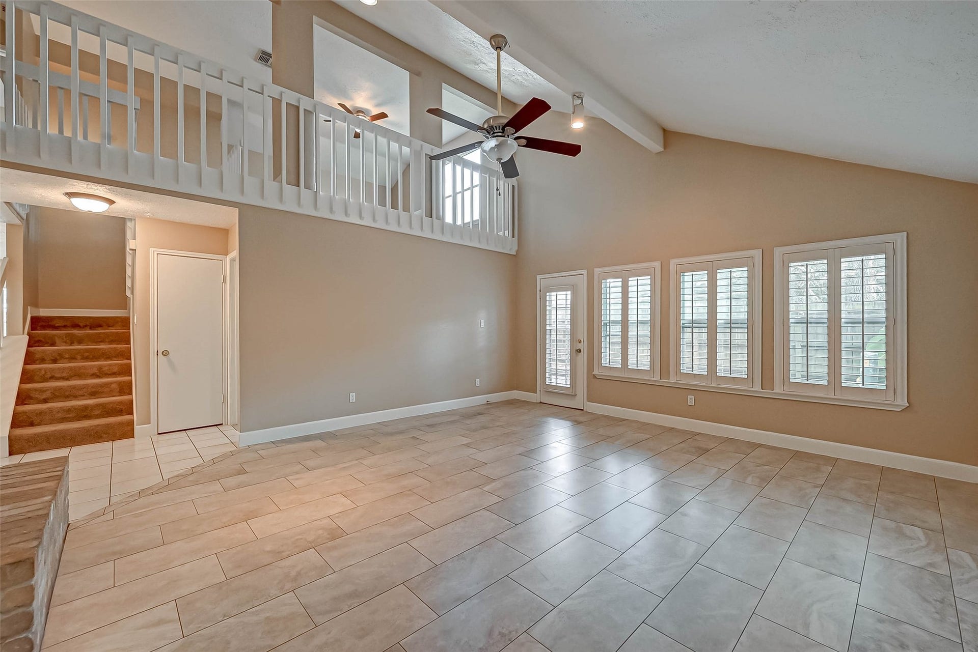 3510 Greenwood Dr Drive, Sugar Land, TX 77478 The family room features a high ceiling, plenty of space and plantation shutters on the windows viewing the backyard!