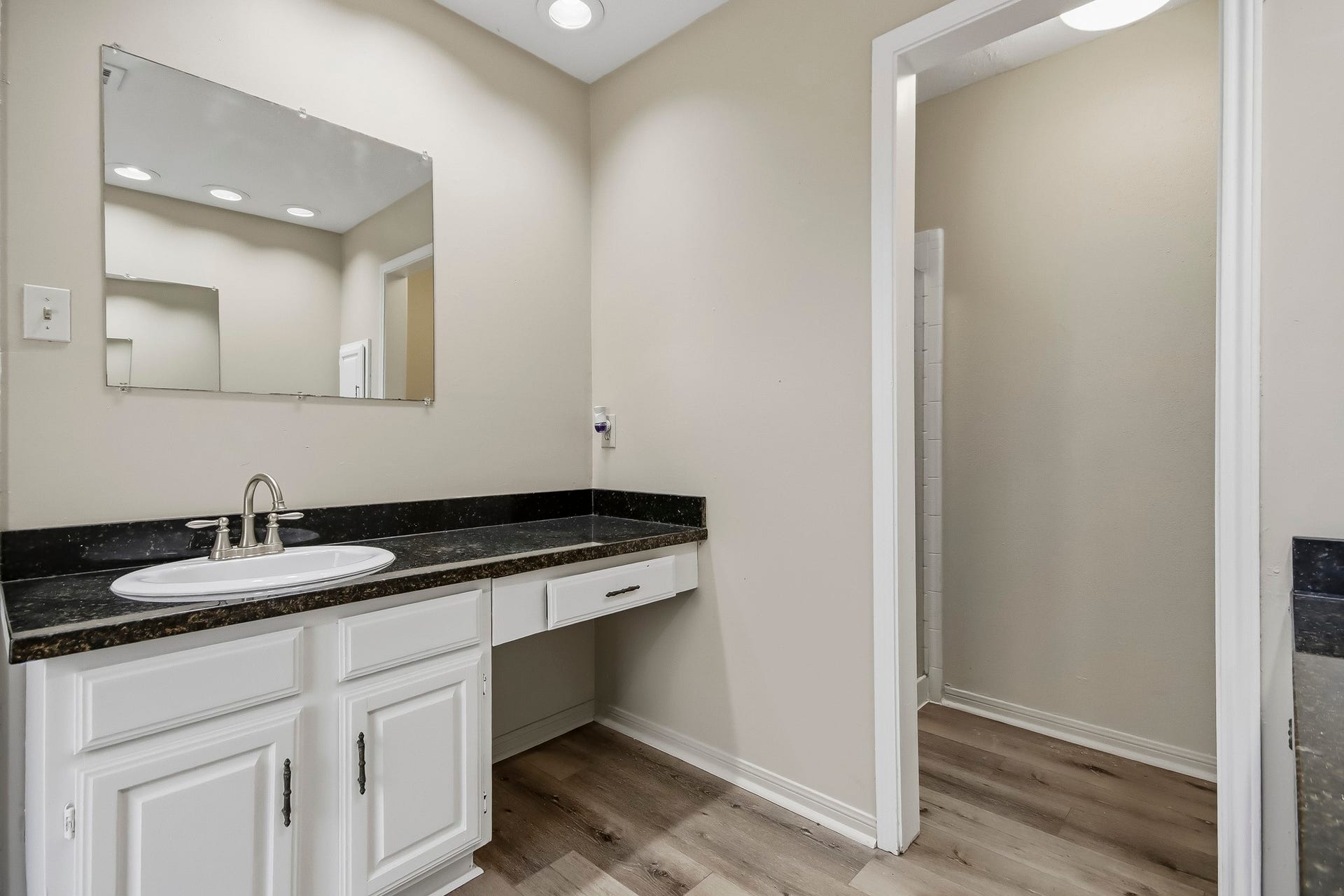 8807 Lakeside Forest Drive, Houston, TX 77088 Another view of the primary ensuite bathroom, featuring a vanity with additional counter space and access to the stand-up shower.
