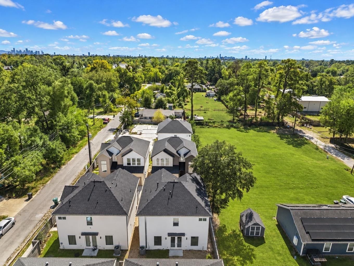 A view of the neighborhood with lush greenery. Virtually enhanced.