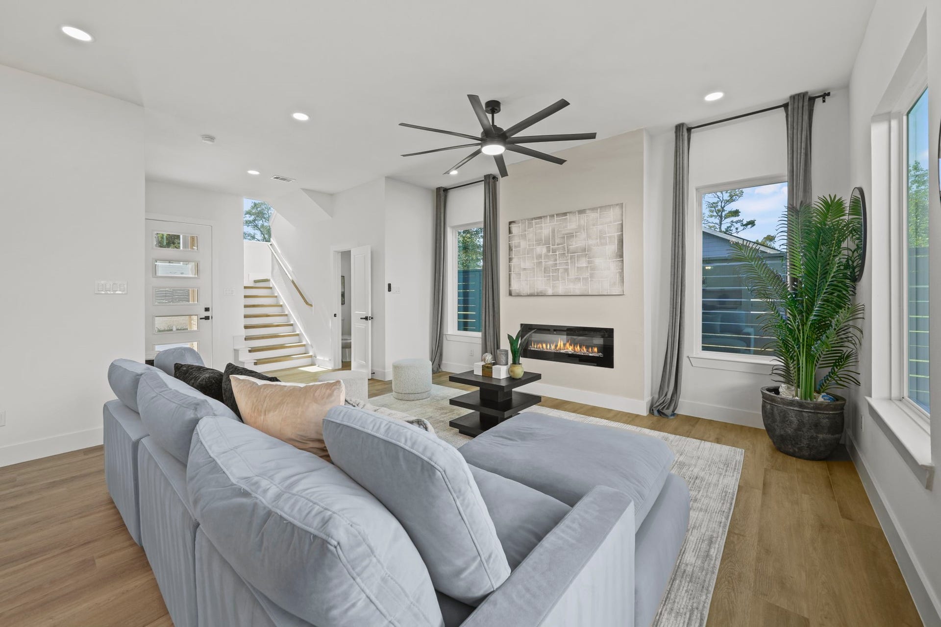 Another angle of the living room showing the spaciouness and stairway to the second floor.