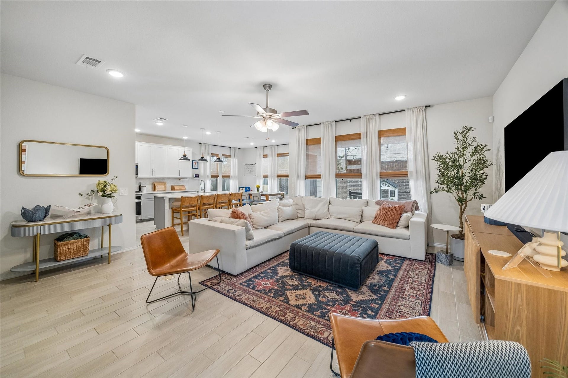 Seamless connection between the family room, kitchen, and dining spaces creates the ideal gathering place.