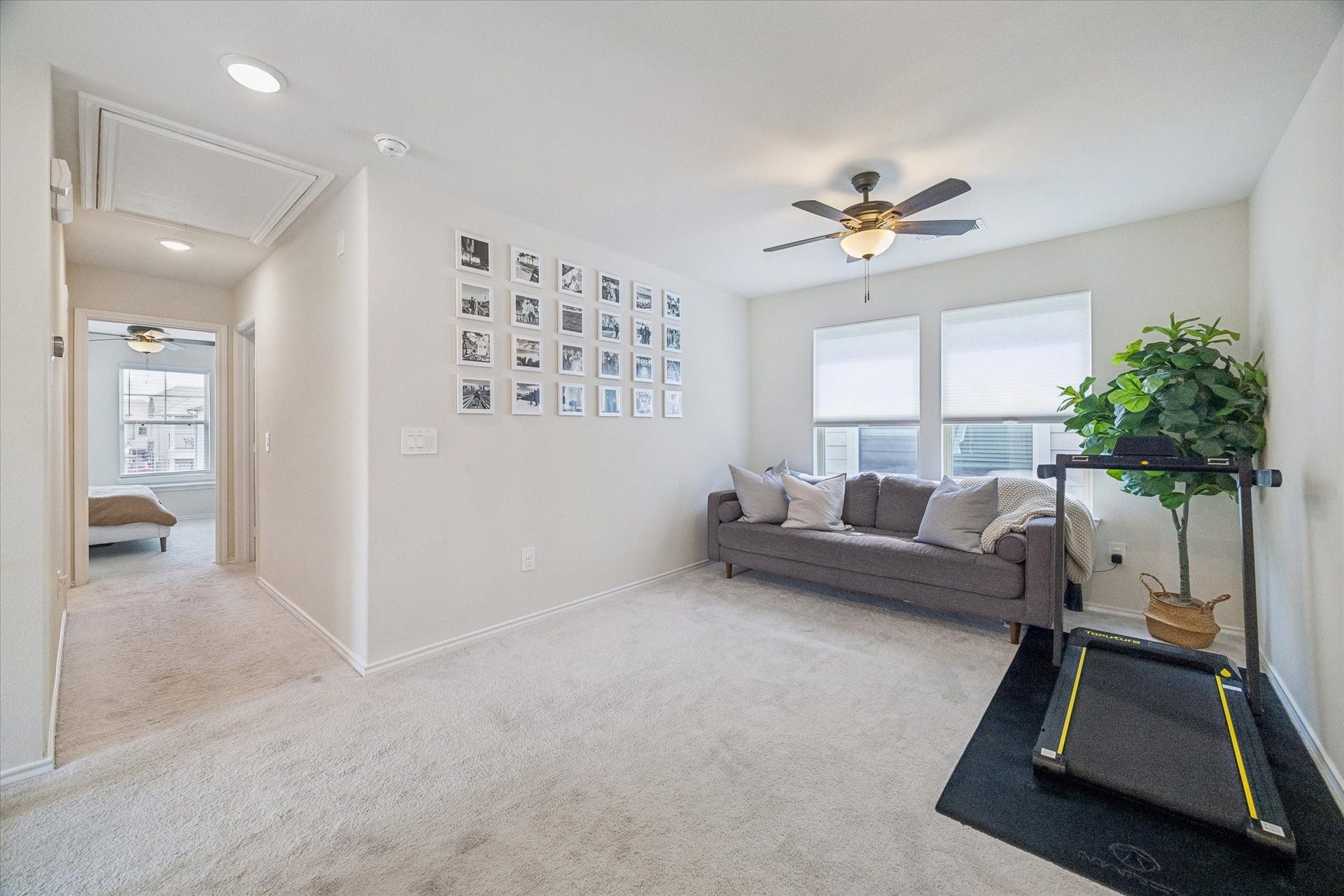 Bright and spacious flex space on the second floor ideal for an additional living room, home office, media room, or workout space.