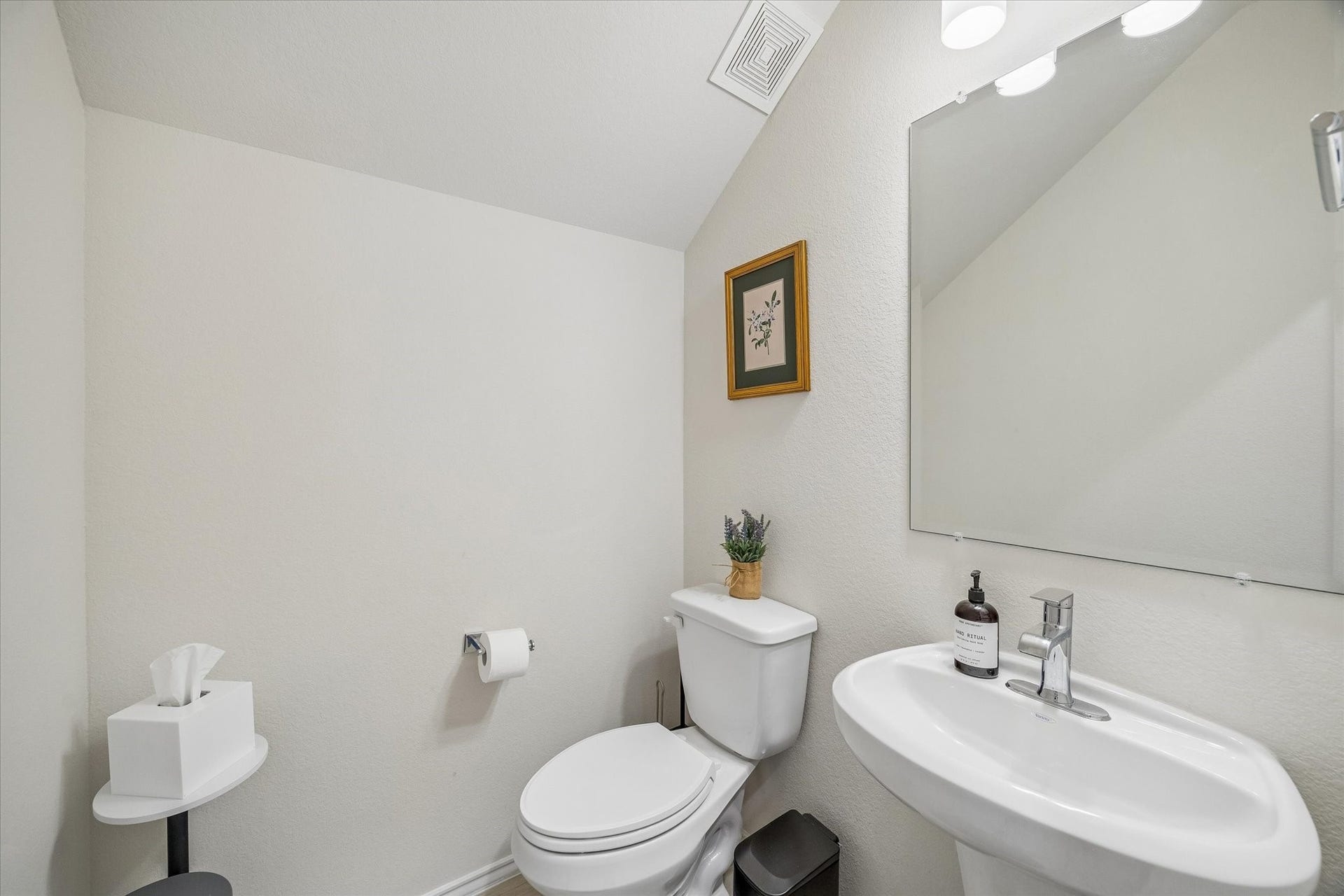 Stylishly appointed half bath located on the main level.