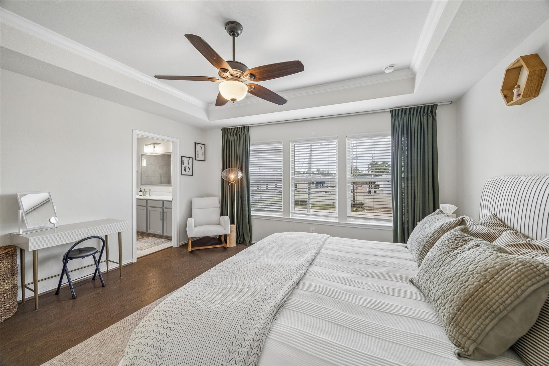 Generously sized bedroom offering comfort, privacy, and direct access to the spa-inspired en-suite bath.