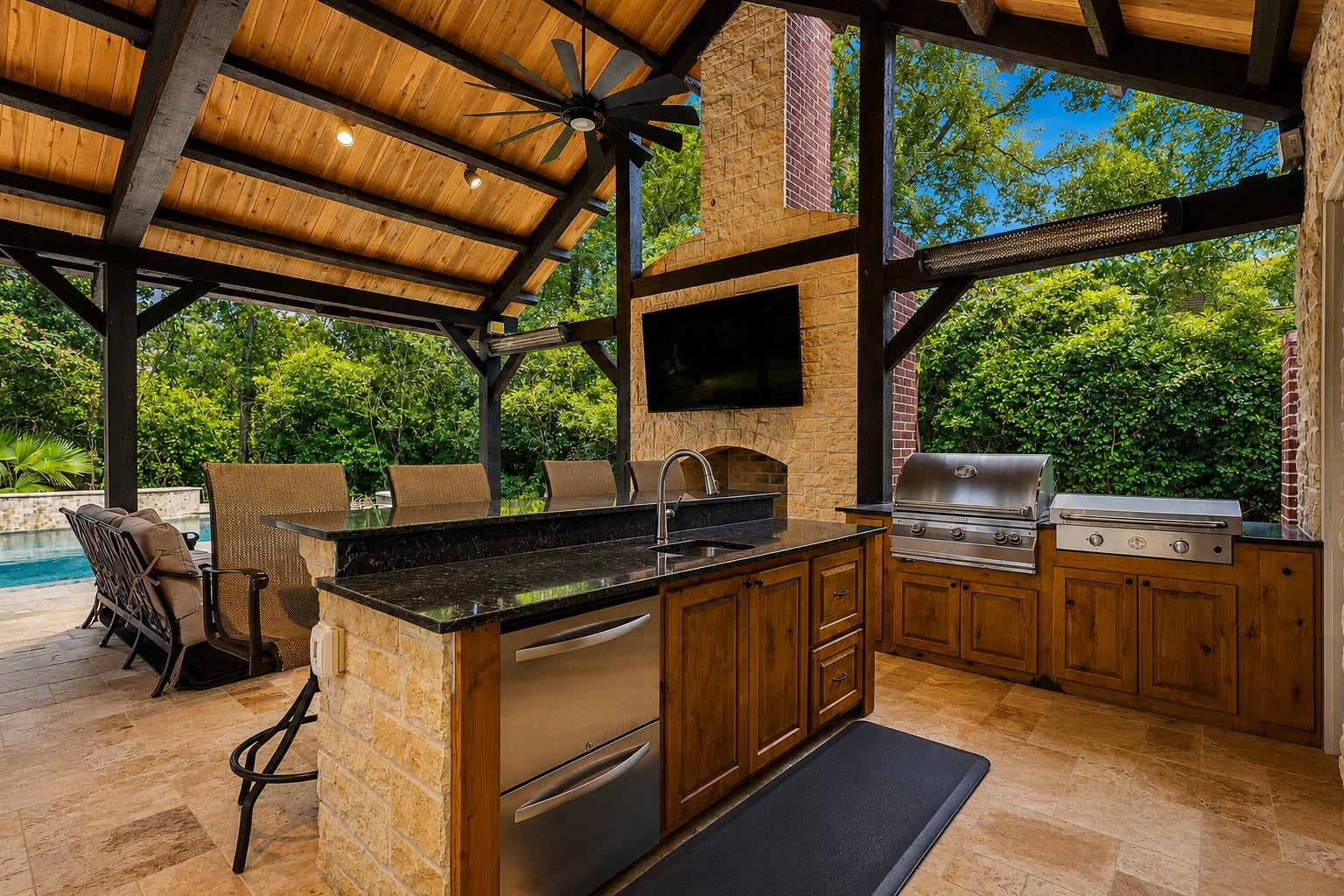 7 Pastoral Pond Circle, The Woodlands, TX 77380 This well-appointed summer kitchen features stainless steel appliances, a spacious built-in grill, custom stone countertops, and ample prep spacethe perfect oasis for sophisticated al fresco dining with heaters for year round entertaining.