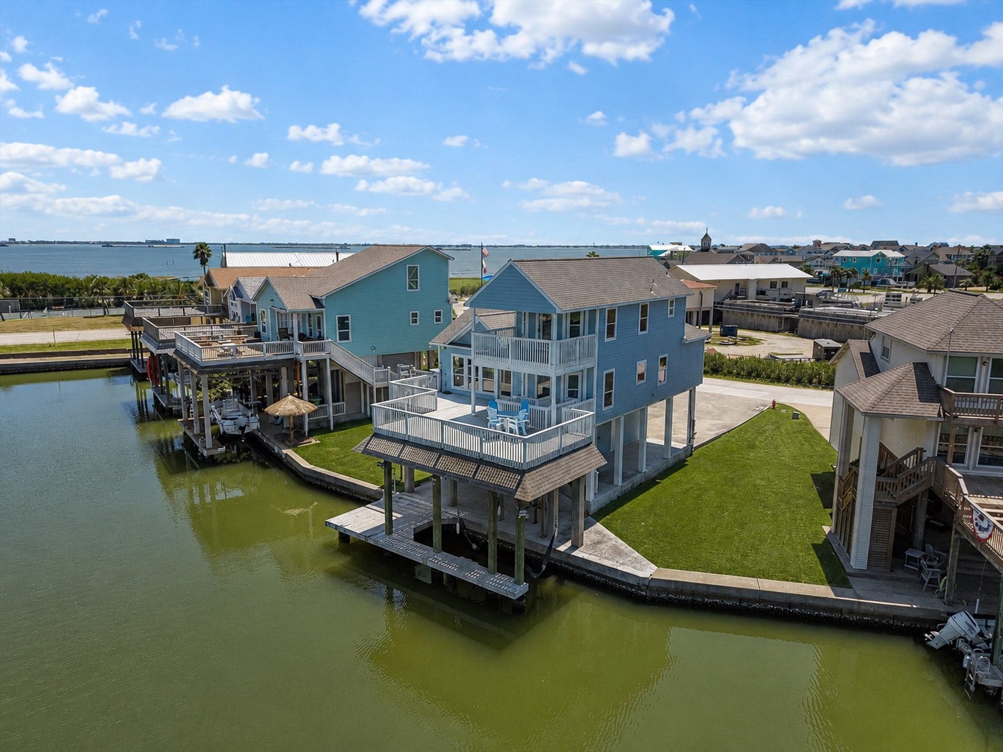314 Windward Way, Tiki Island, TX 77554 Experience elevated waterfront living in Tiki Island! This immaculately maintained coastal retreat welcomes you