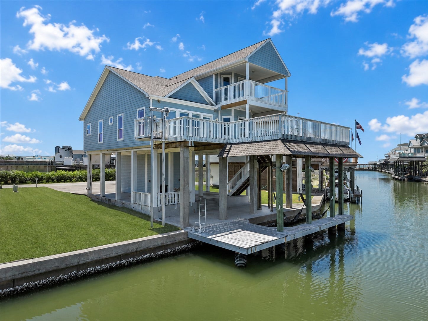 314 Windward Way, Tiki Island, TX 77554 Experience elevated waterfront living in Tiki Island! This immaculately maintained coastal retreat welcomes you