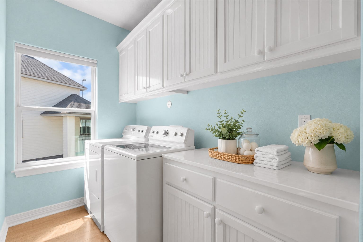 314 Windward Way, Tiki Island, TX 77554 The laundry room offers generous counter space and an abundance of cabinetry for added storage and functionality.
